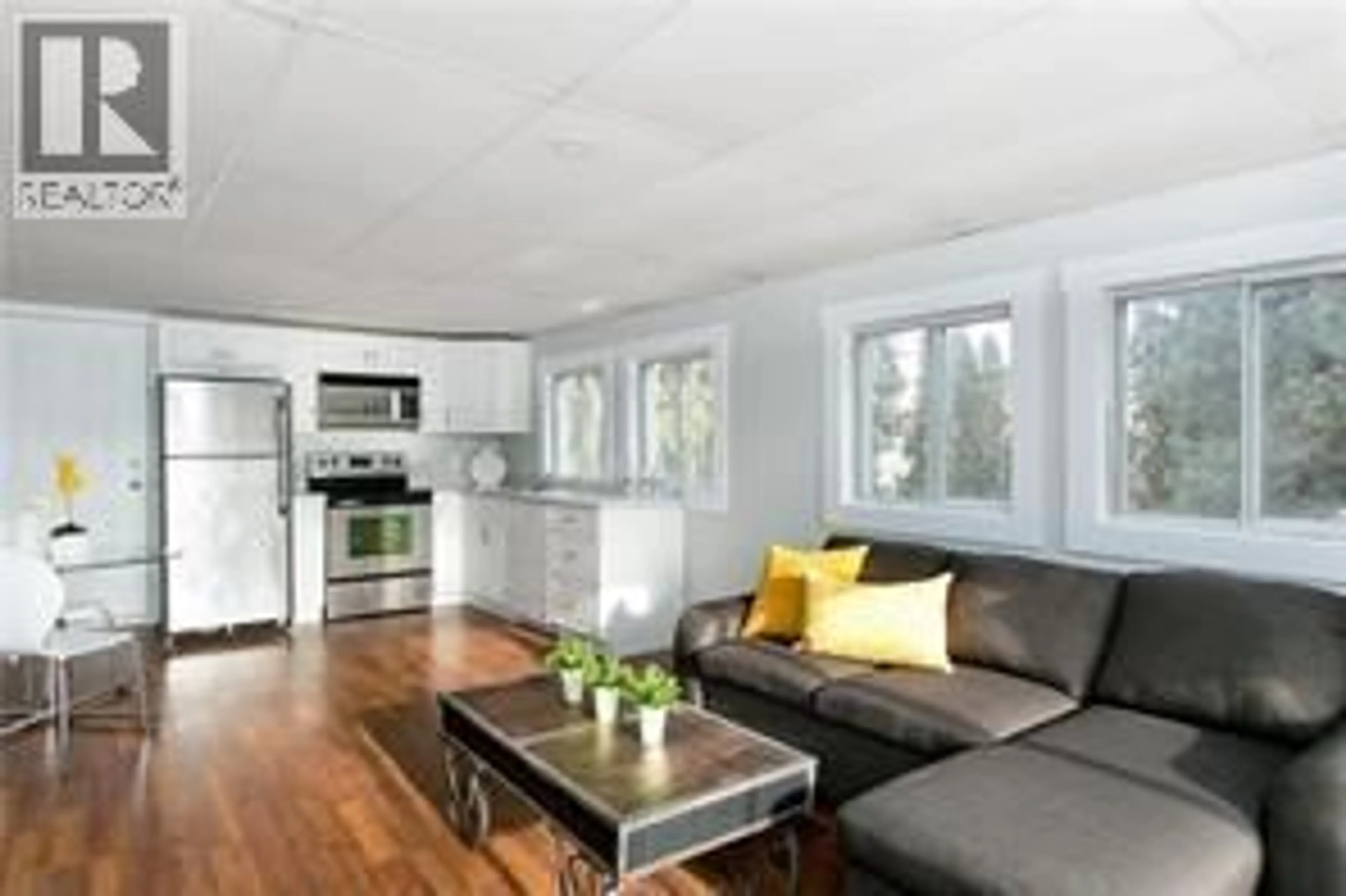 Open concept kitchen, wood/laminate floor for 130 DYSART ROAD, Kelowna British Columbia V1X3R1