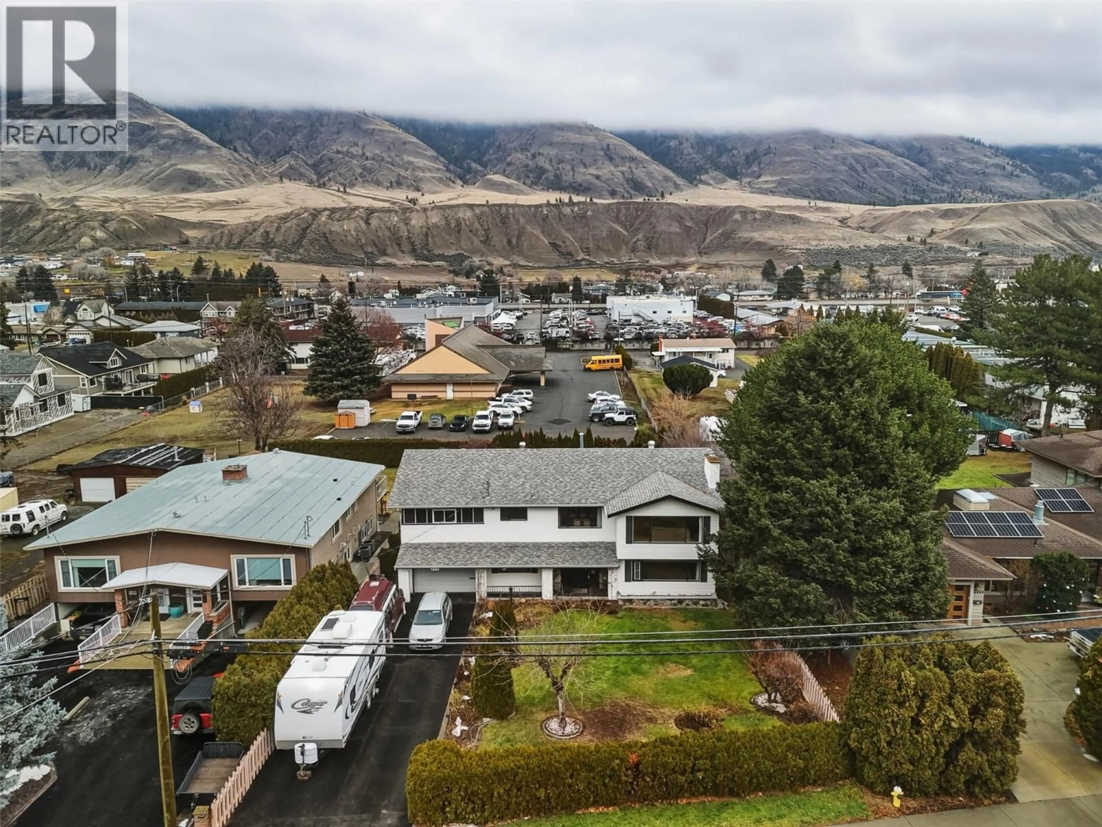 A pic from outside/outdoor area/front of a property/back of a property/a pic from drone, mountain view for 2480 VALLEYVIEW DRIVE, Kamloops British Columbia V2C4E3