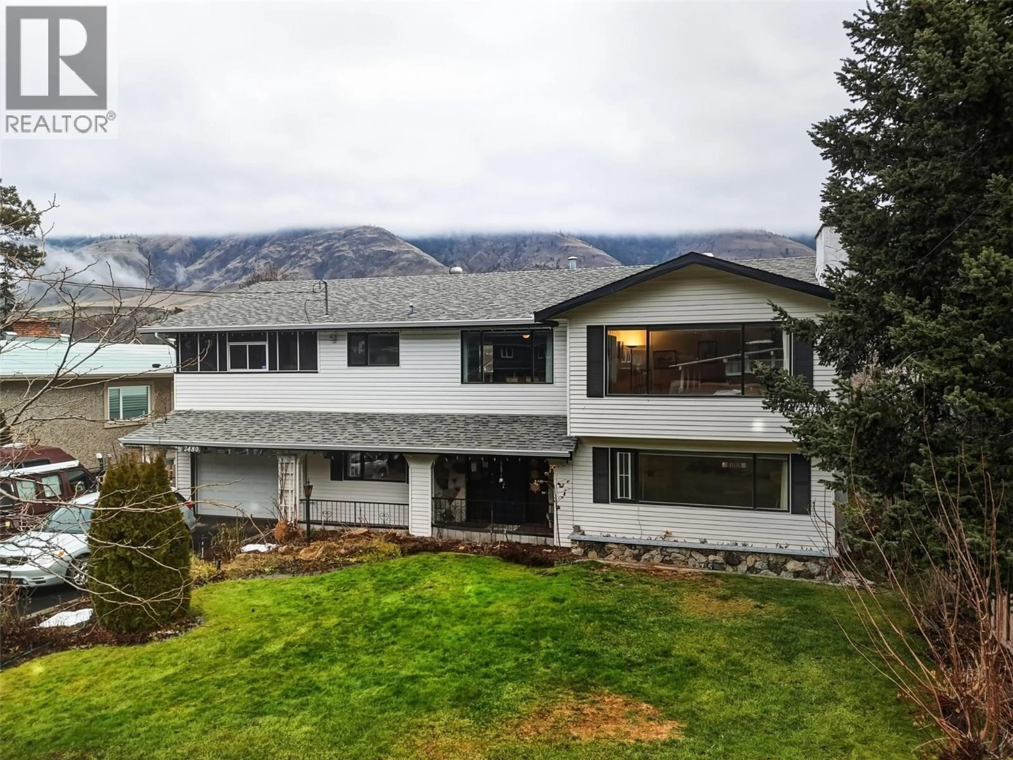 A pic from outside/outdoor area/front of a property/back of a property/a pic from drone, mountain view for 2480 VALLEYVIEW DRIVE, Kamloops British Columbia V2C4E3