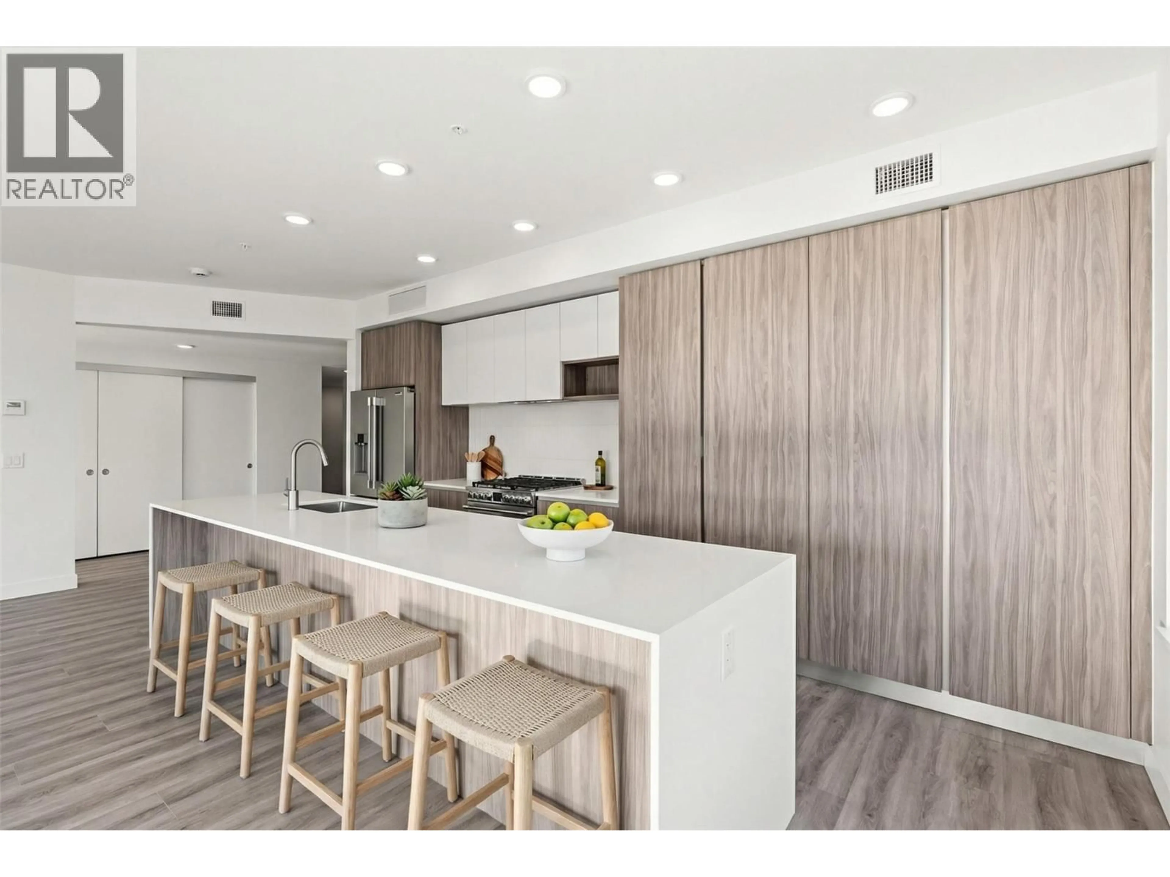 Open concept kitchen, wood/laminate floor for 207 - 2760 OLALLA ROAD, West Kelowna British Columbia V1Z2A9