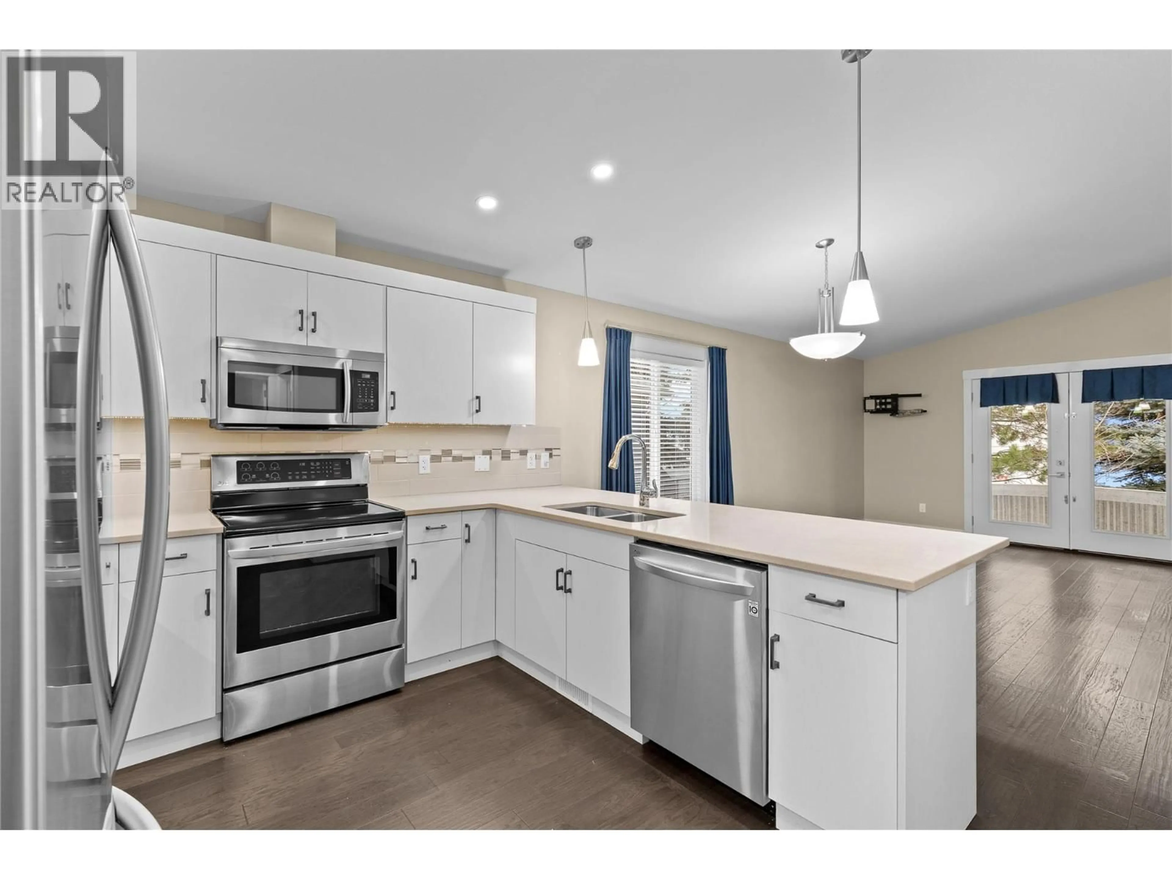Open concept kitchen, ceramic/tile floor for 63 - 2100 55 AVENUE, Vernon British Columbia V1T9Y6