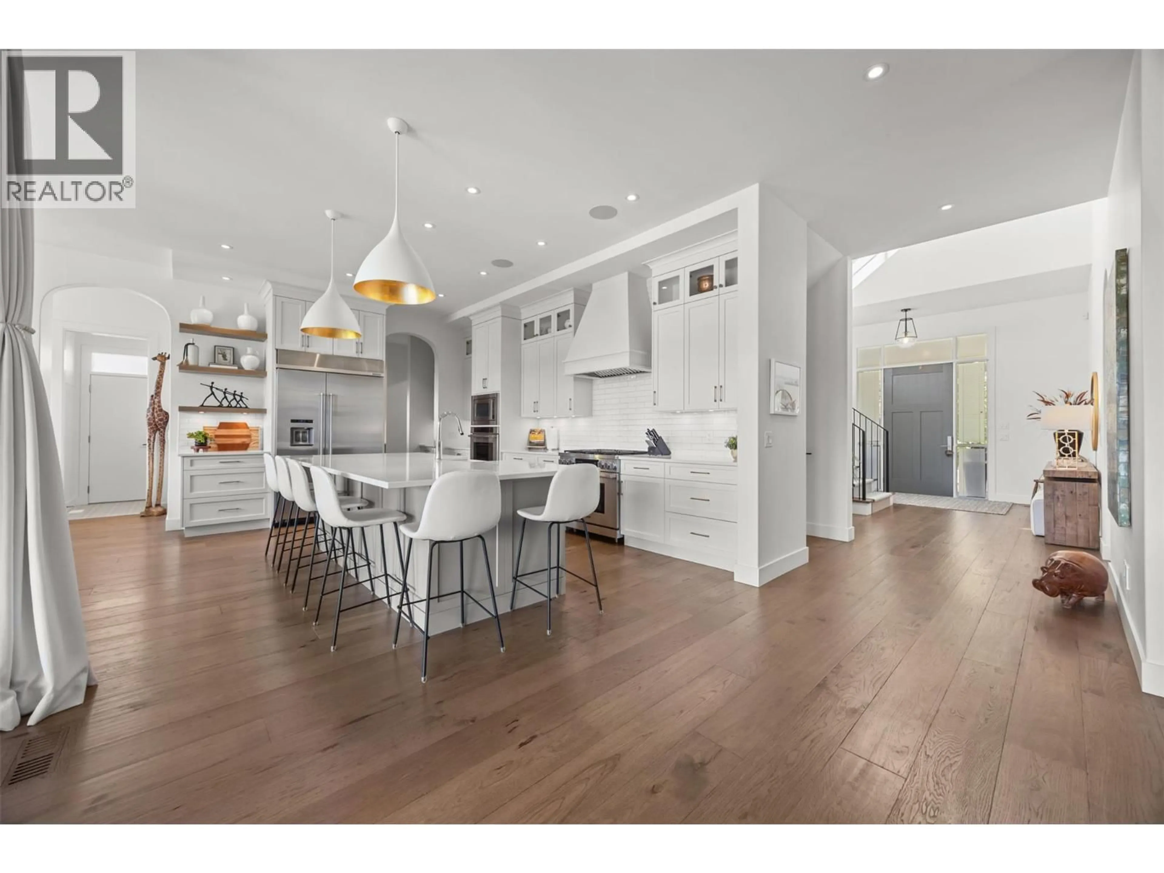 Open concept kitchen, wood/laminate floor for 114 RED SKY COURT, Kelowna British Columbia V1V3G4