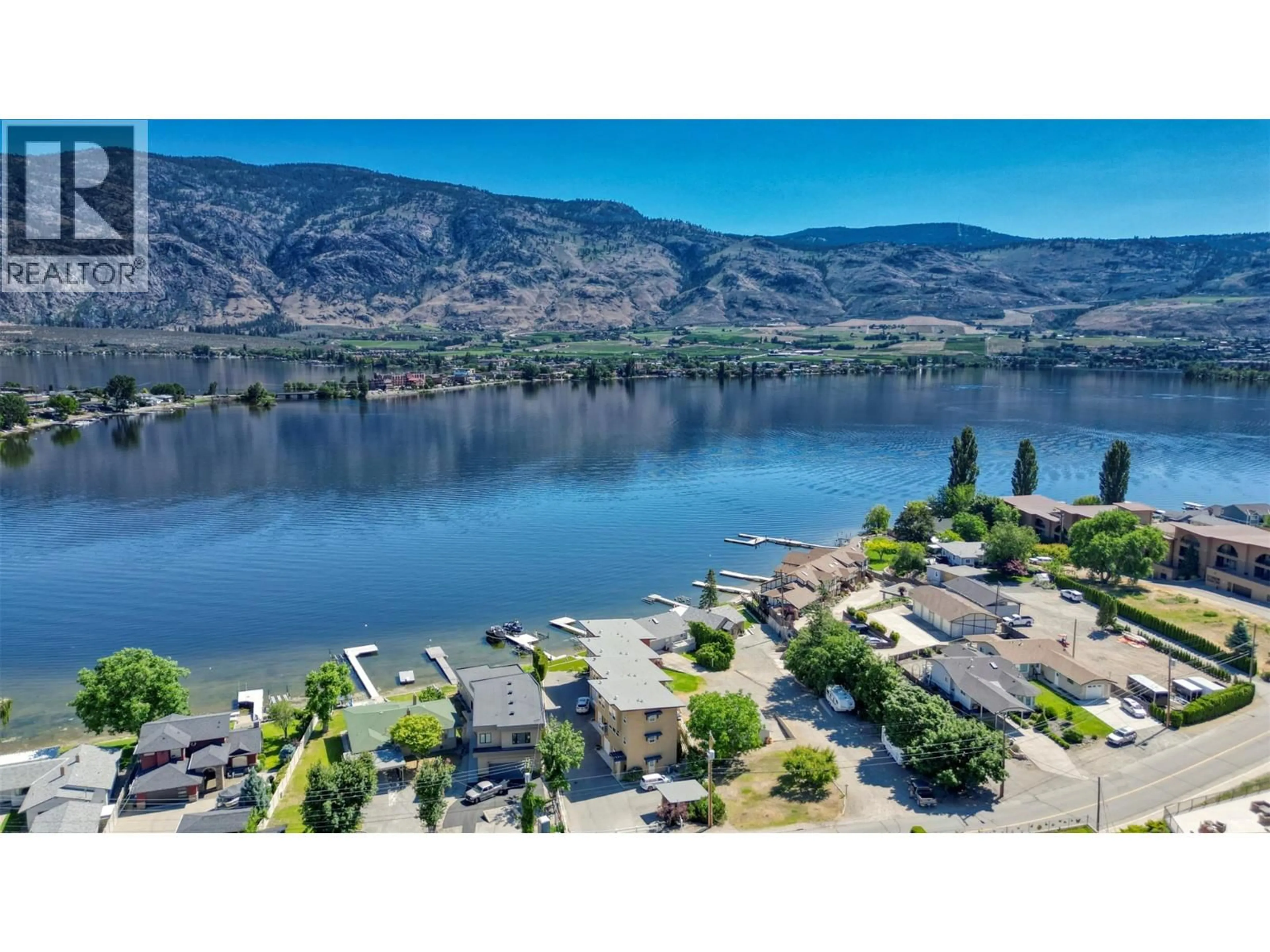 A pic from outside/outdoor area/front of a property/back of a property/a pic from drone, water/lake/river/ocean view for 1 - 5405 OLEANDER DRIVE, Osoyoos British Columbia V0H1V0