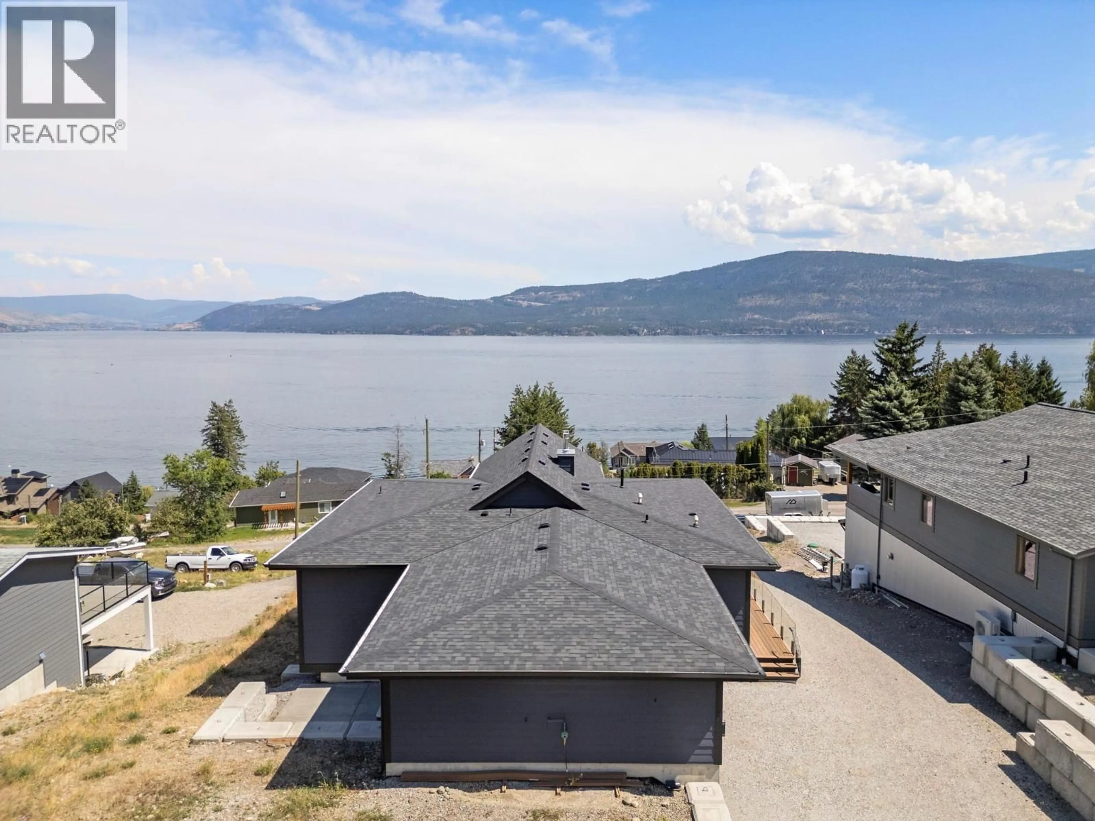 A pic from outside/outdoor area/front of a property/back of a property/a pic from drone, water/lake/river/ocean view for 8 KENYON ROAD, Vernon British Columbia V1H2C6