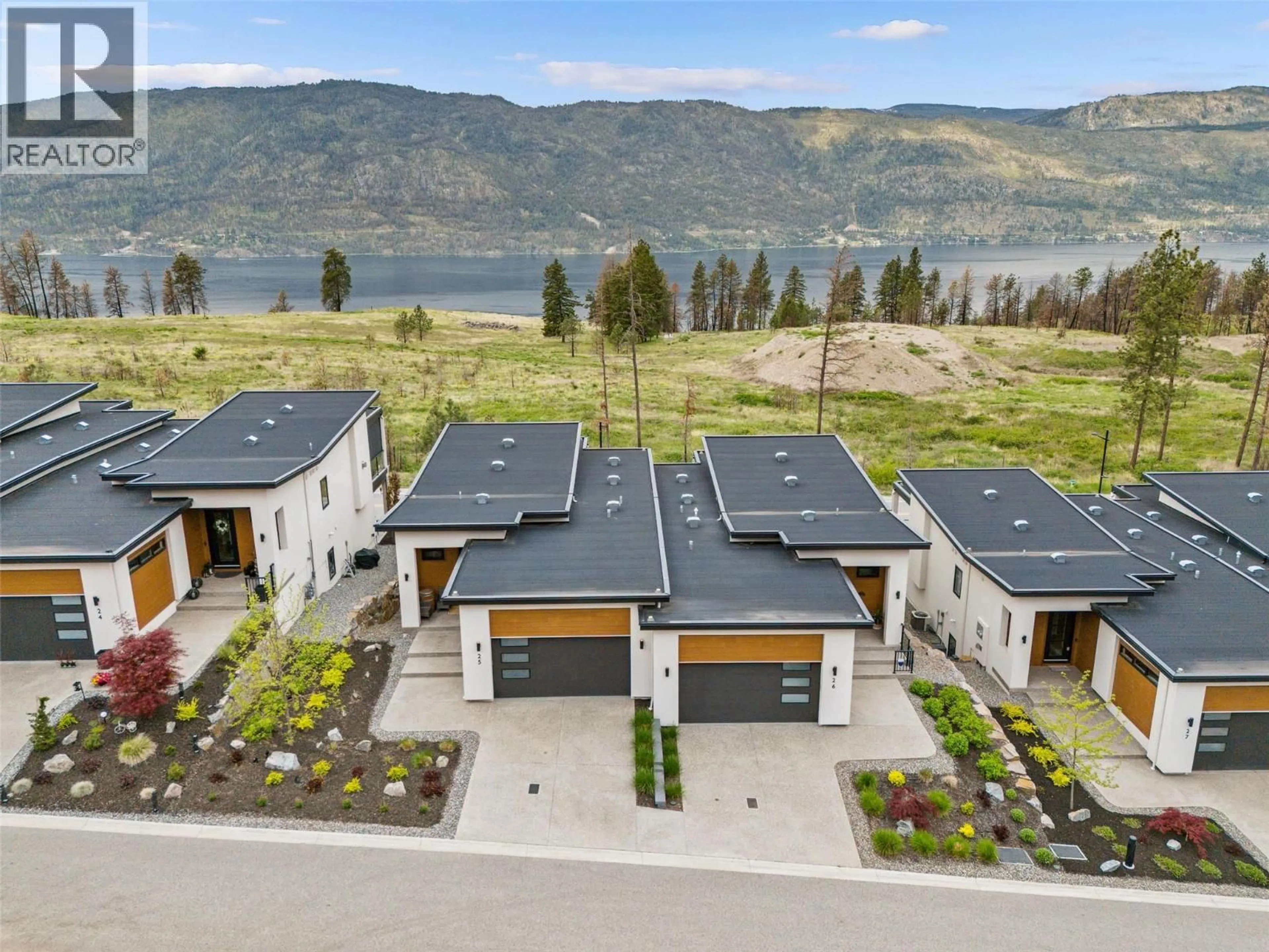 A pic from outside/outdoor area/front of a property/back of a property/a pic from drone, water/lake/river/ocean view for 25 - 10100 TYNDALL ROAD, Lake Country British Columbia V4V0A9