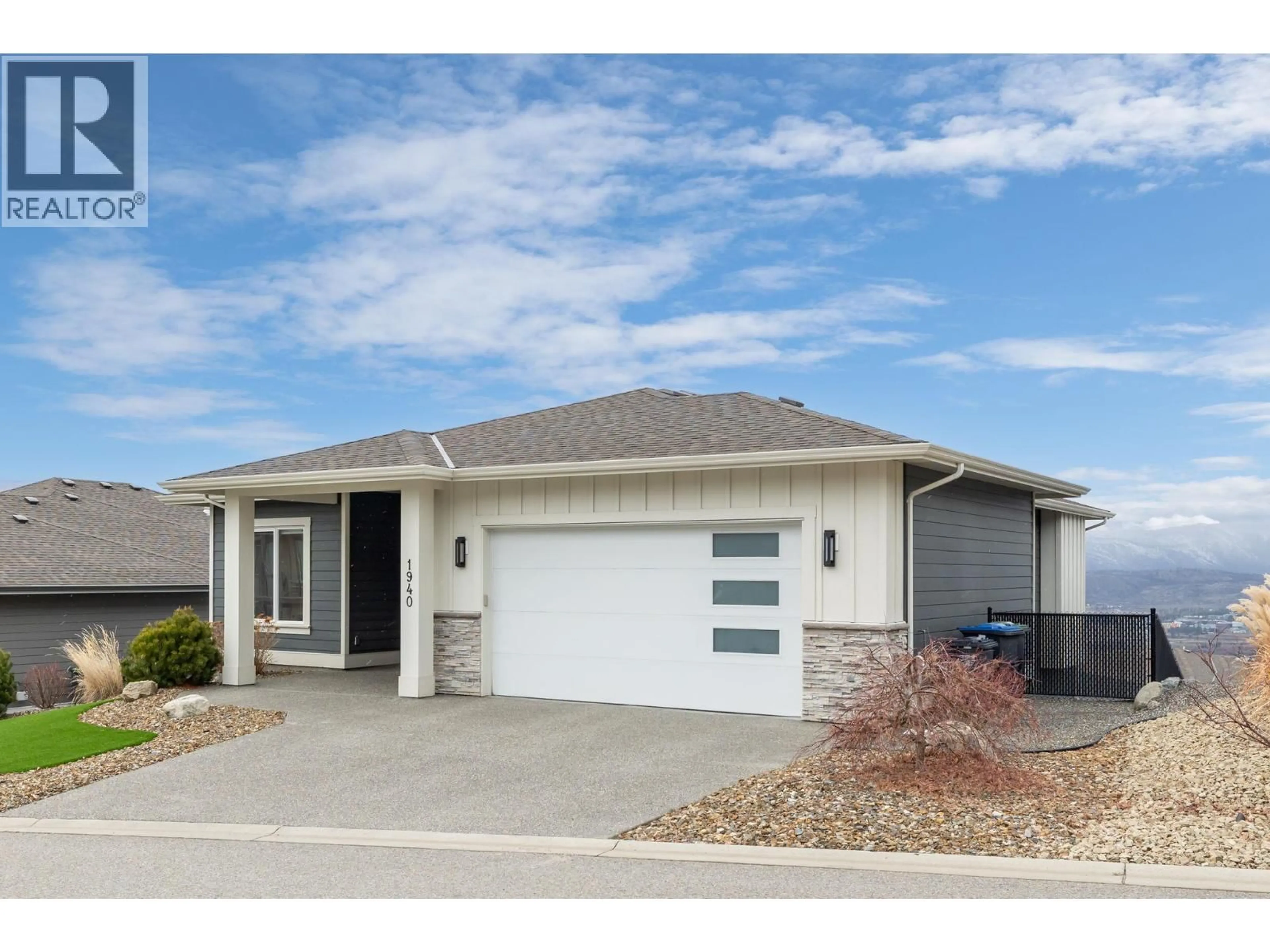 Home with vinyl exterior material, street for 1940 FOXTAIL TERRACE, Kelowna British Columbia V1P1T9