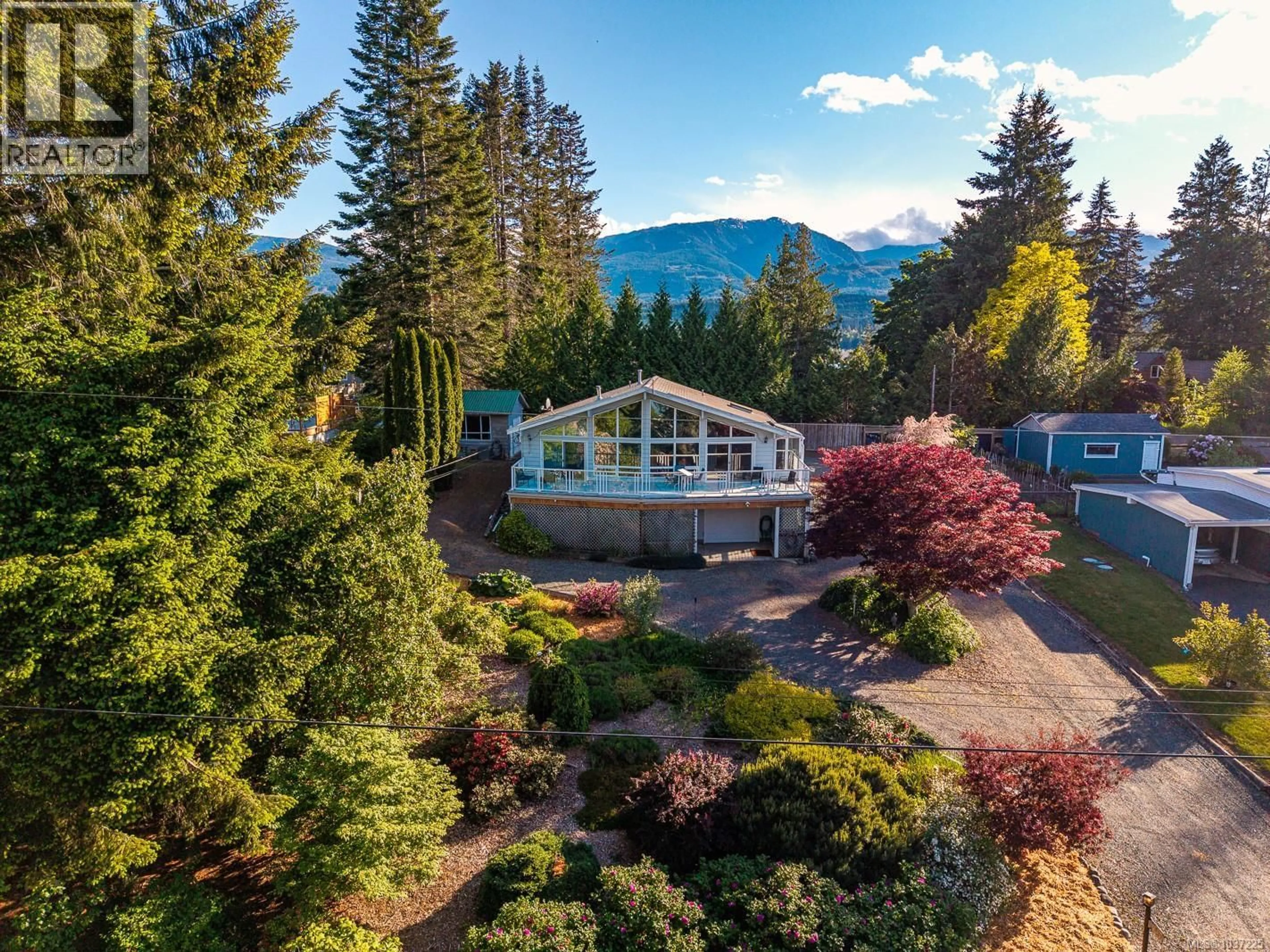 A pic from outside/outdoor area/front of a property/back of a property/a pic from drone, mountain view for 7627 SHIPS POINT ROAD, Fanny Bay British Columbia V0R1W0