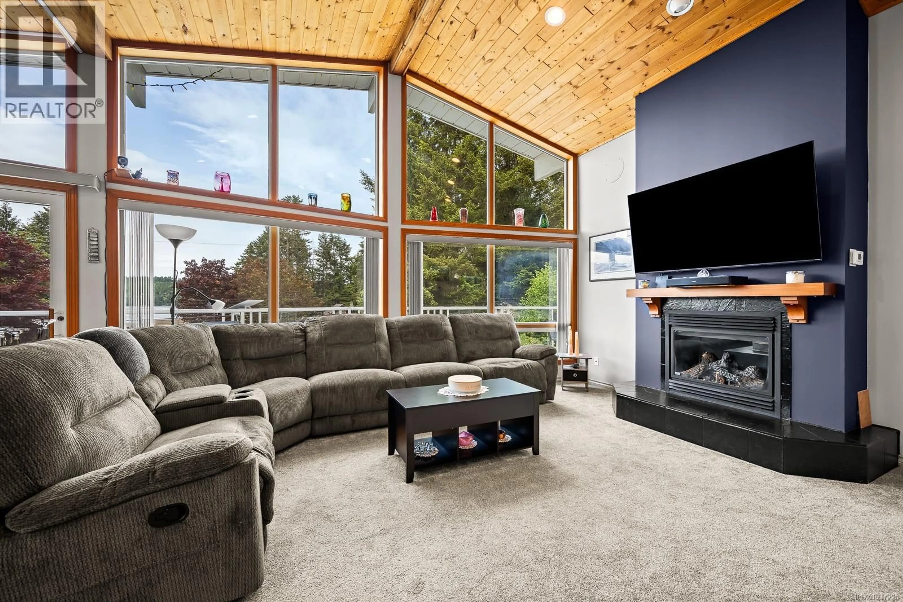 Living room with furniture, unknown for 7627 SHIPS POINT ROAD, Fanny Bay British Columbia V0R1W0