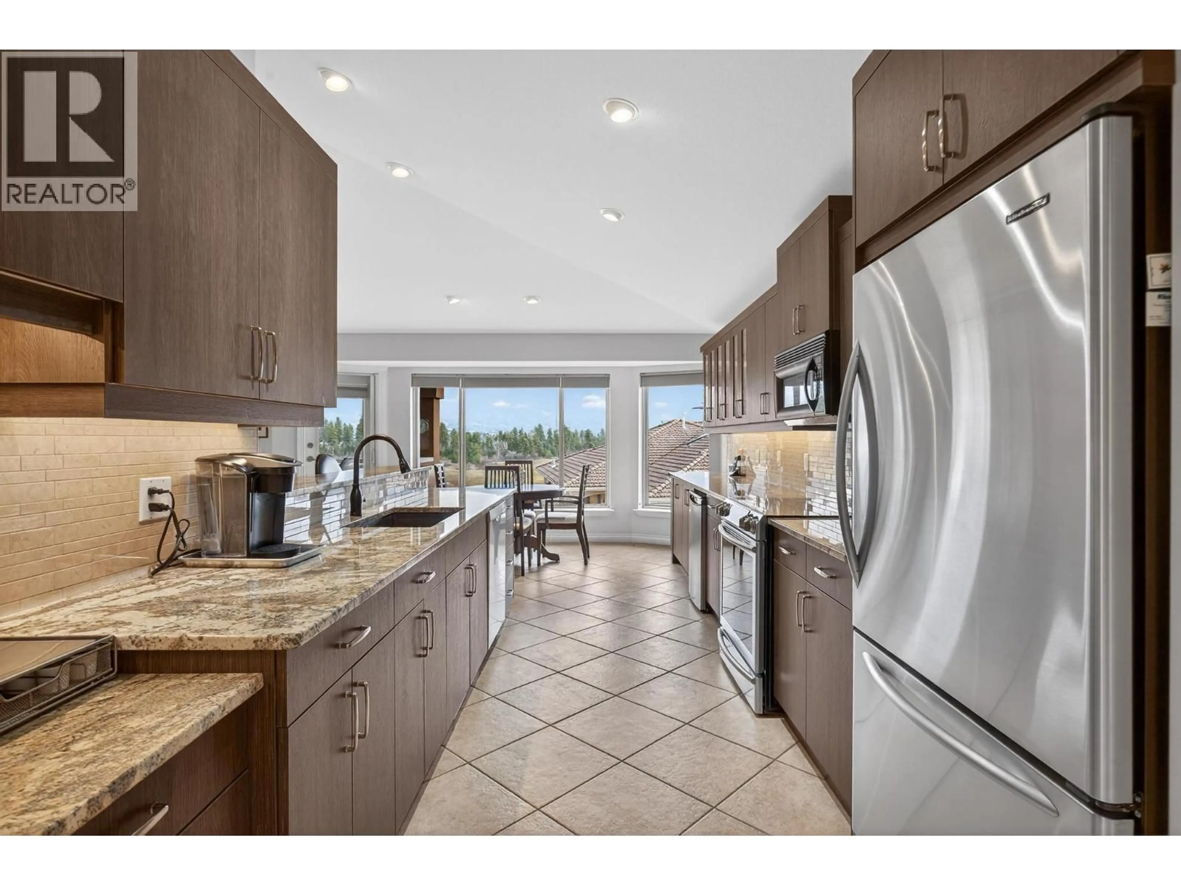 Open concept kitchen, ceramic/tile floor for 201 - 2455 QUAIL RIDGE BOULEVARD, Kelowna British Columbia V1V2S8