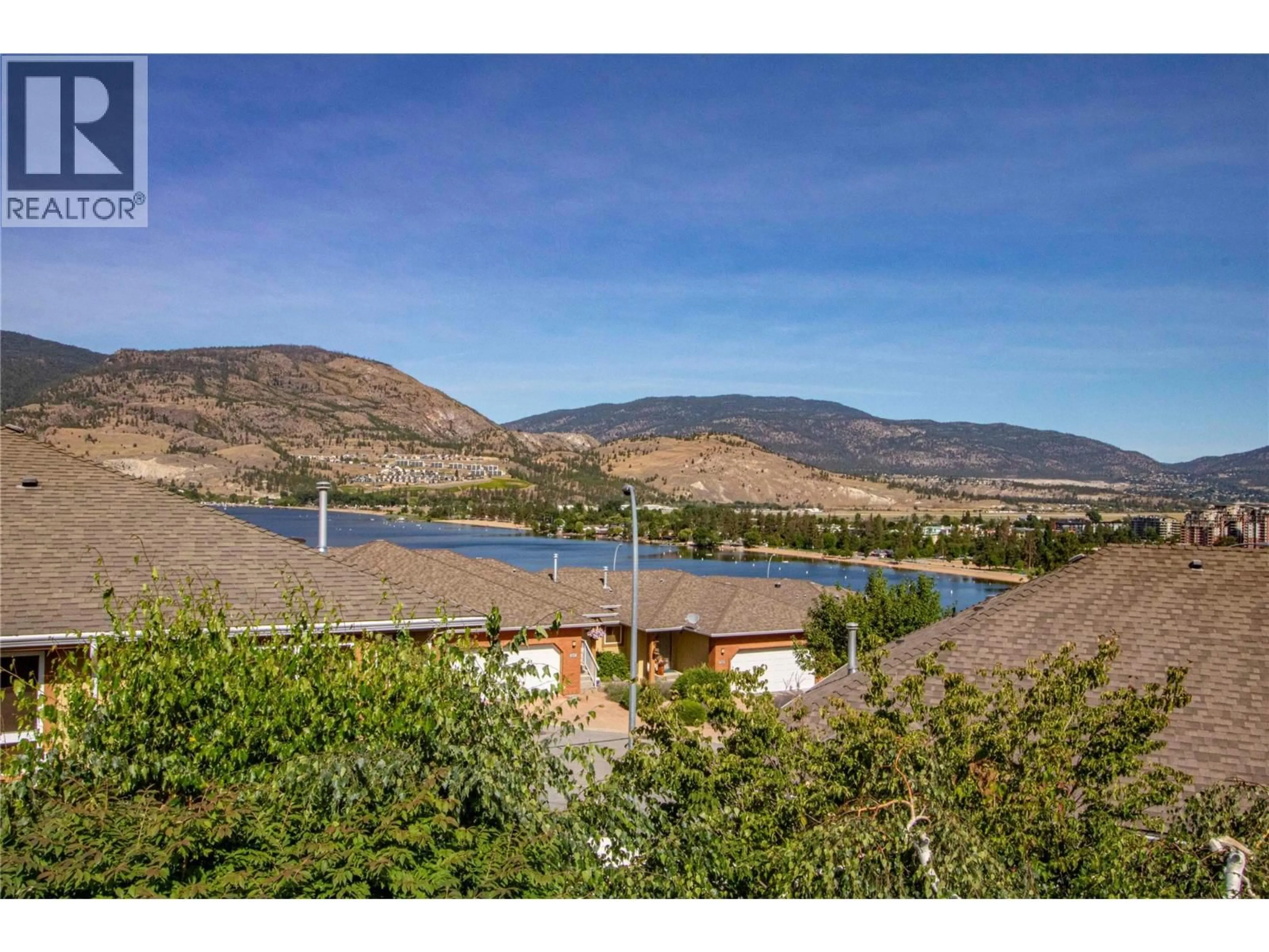 A pic from outside/outdoor area/front of a property/back of a property/a pic from drone, water/lake/river/ocean view for 145 - 3948 FINNERTY ROAD, Penticton British Columbia V2A8P8