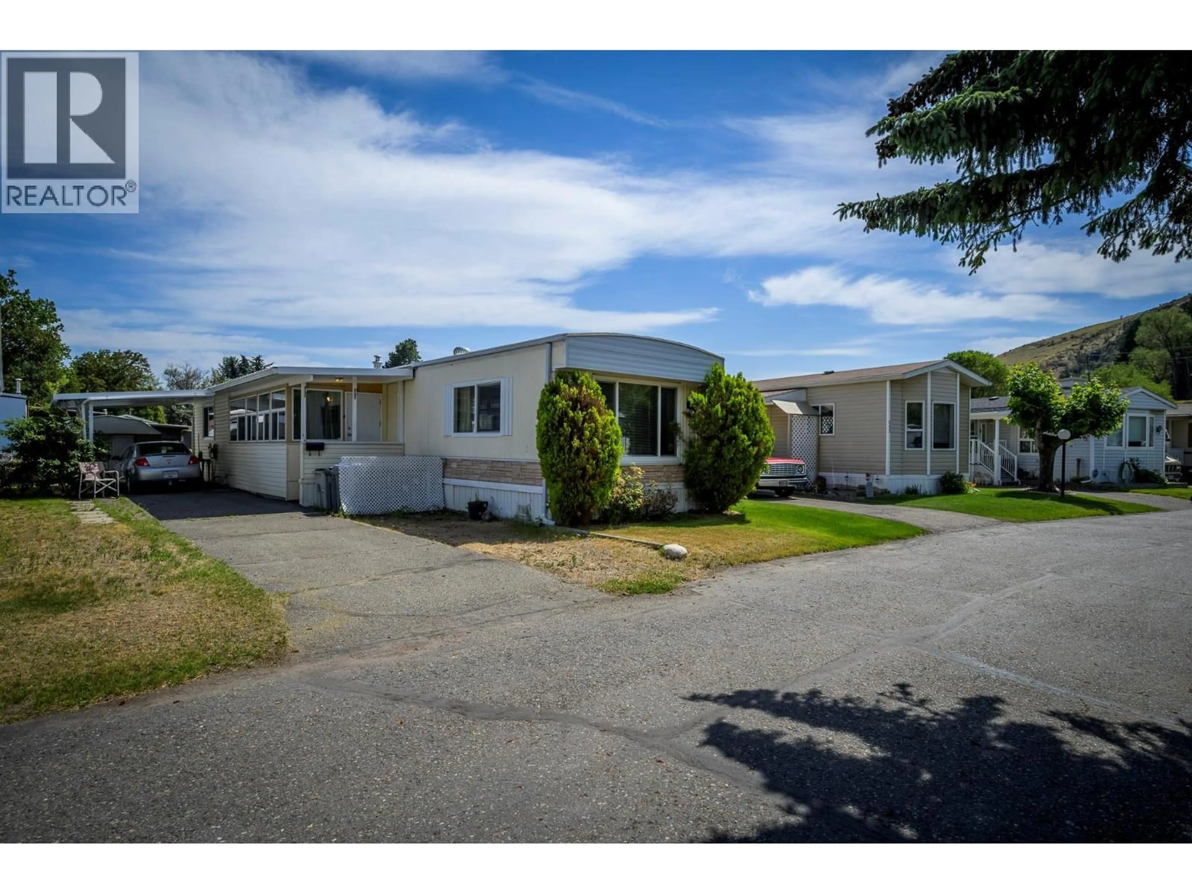 A pic from outside/outdoor area/front of a property/back of a property/a pic from drone, street for 216 - 2400 OAKDALE WAY, Kamloops British Columbia V2B6W7