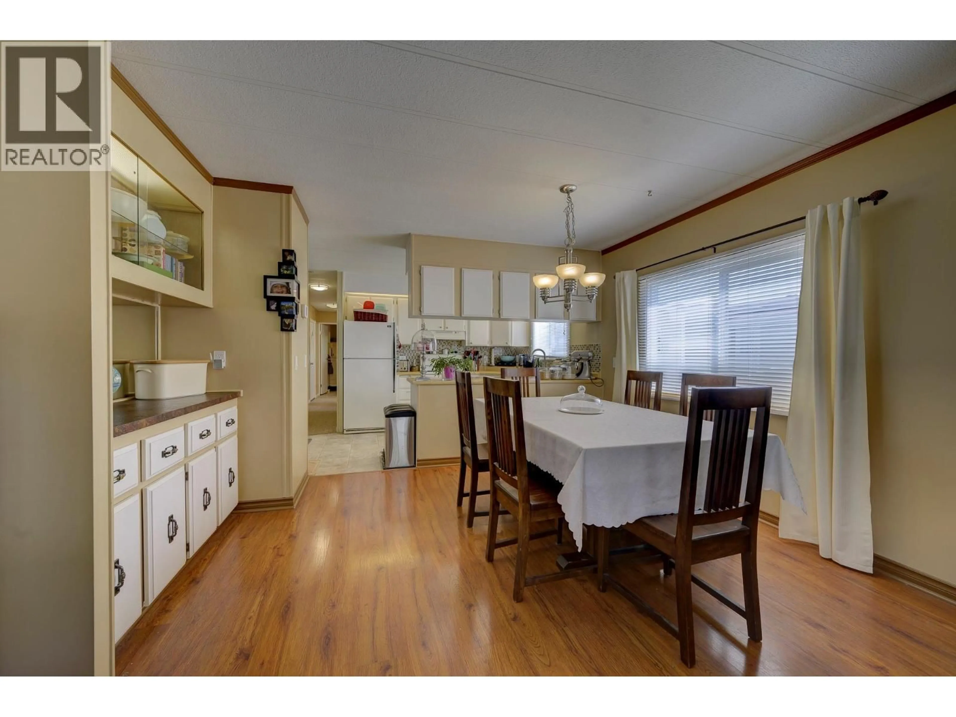 Dining room, wood/laminate floor for 216 - 2400 OAKDALE WAY, Kamloops British Columbia V2B6W7