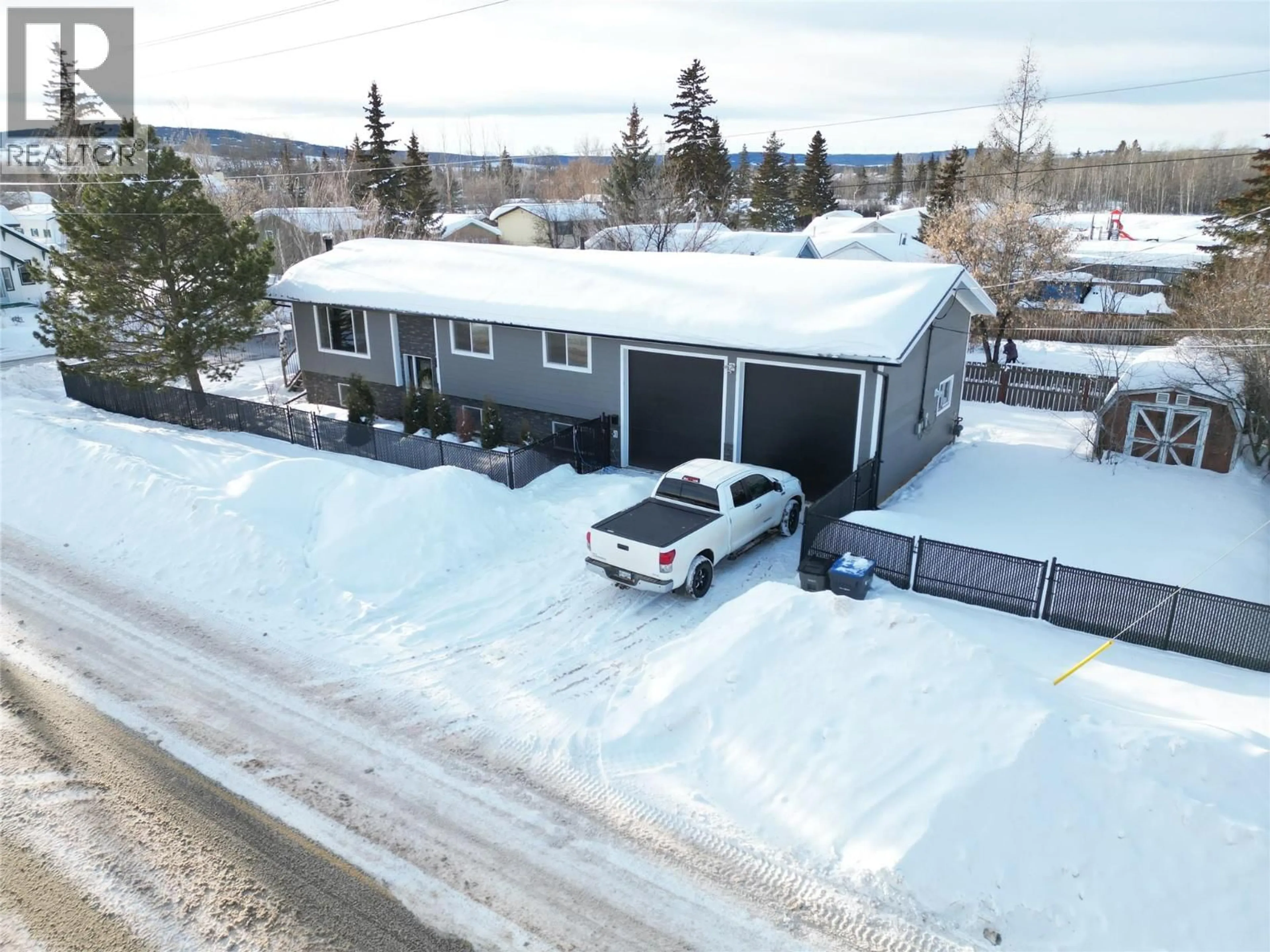 A pic from outside/outdoor area/front of a property/back of a property/a pic from drone, street for 1500 105 AVENUE, Dawson Creek British Columbia V1G2M4