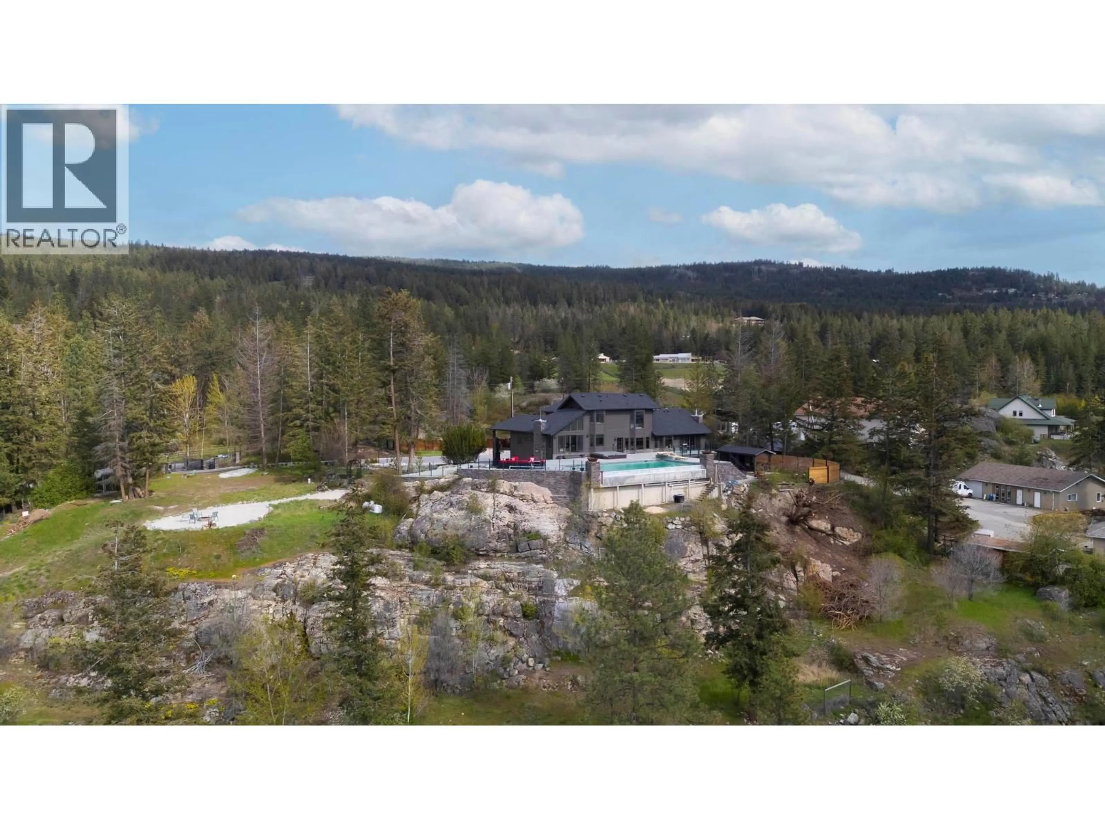 A pic from outside/outdoor area/front of a property/back of a property/a pic from drone, mountain view for 5774 DEADPINE DRIVE, Kelowna British Columbia V1P1A3
