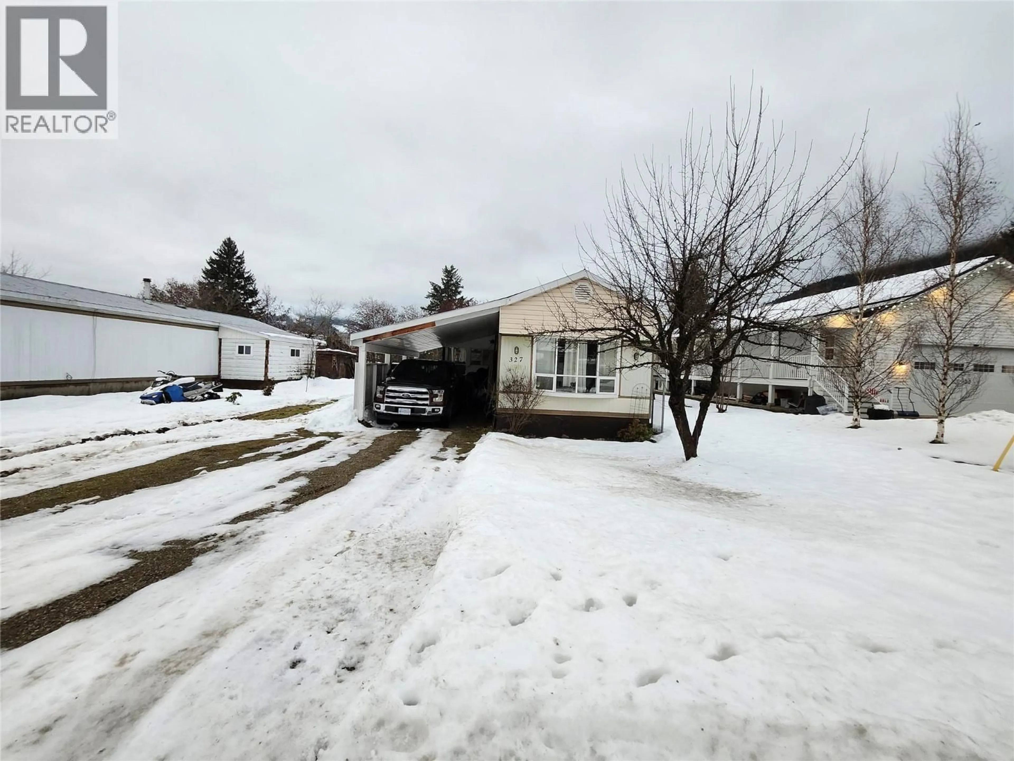 A pic from outside/outdoor area/front of a property/back of a property/a pic from drone, street for 327 EDWARD STREET, Revelstoke British Columbia V0E2S0