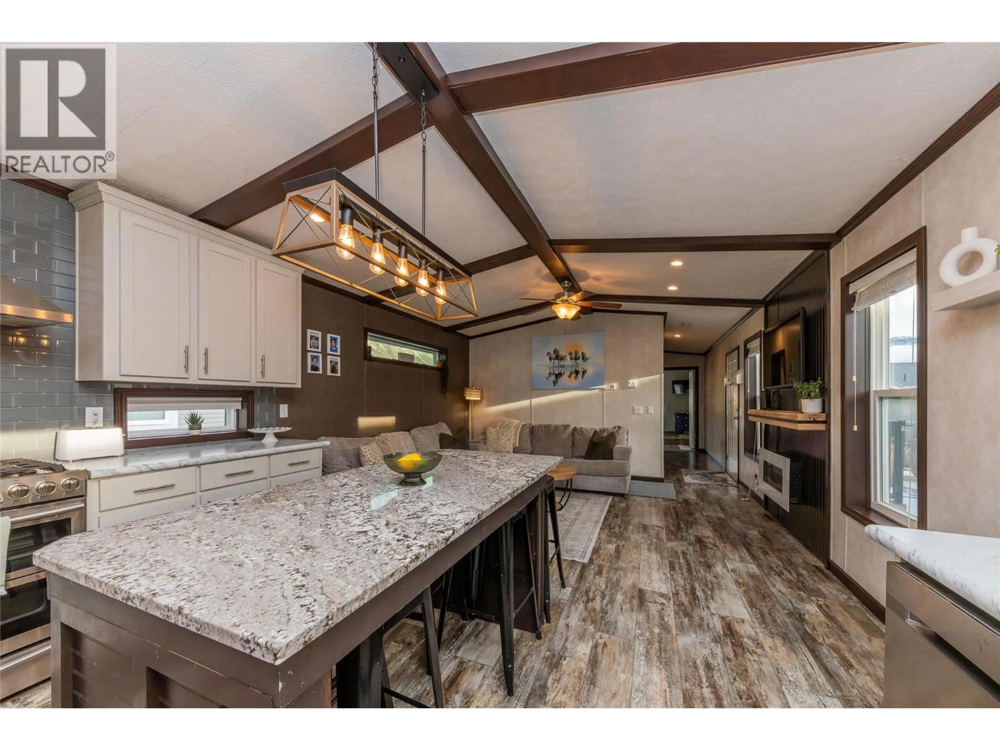 Open concept kitchen, wood/laminate floor for 103 - 5005 RIVER ROAD, Pritchard British Columbia V0E2P0