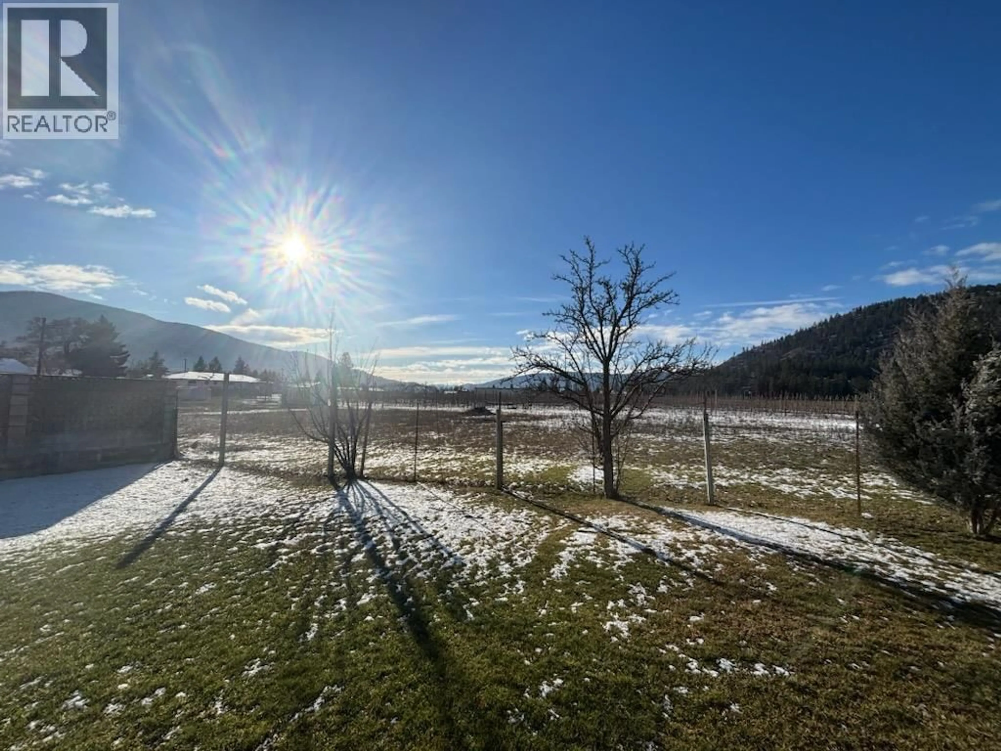 A pic from outside/outdoor area/front of a property/back of a property/a pic from drone, mountain view for 7551 23RD STREET, Grand Forks British Columbia V0H1H2