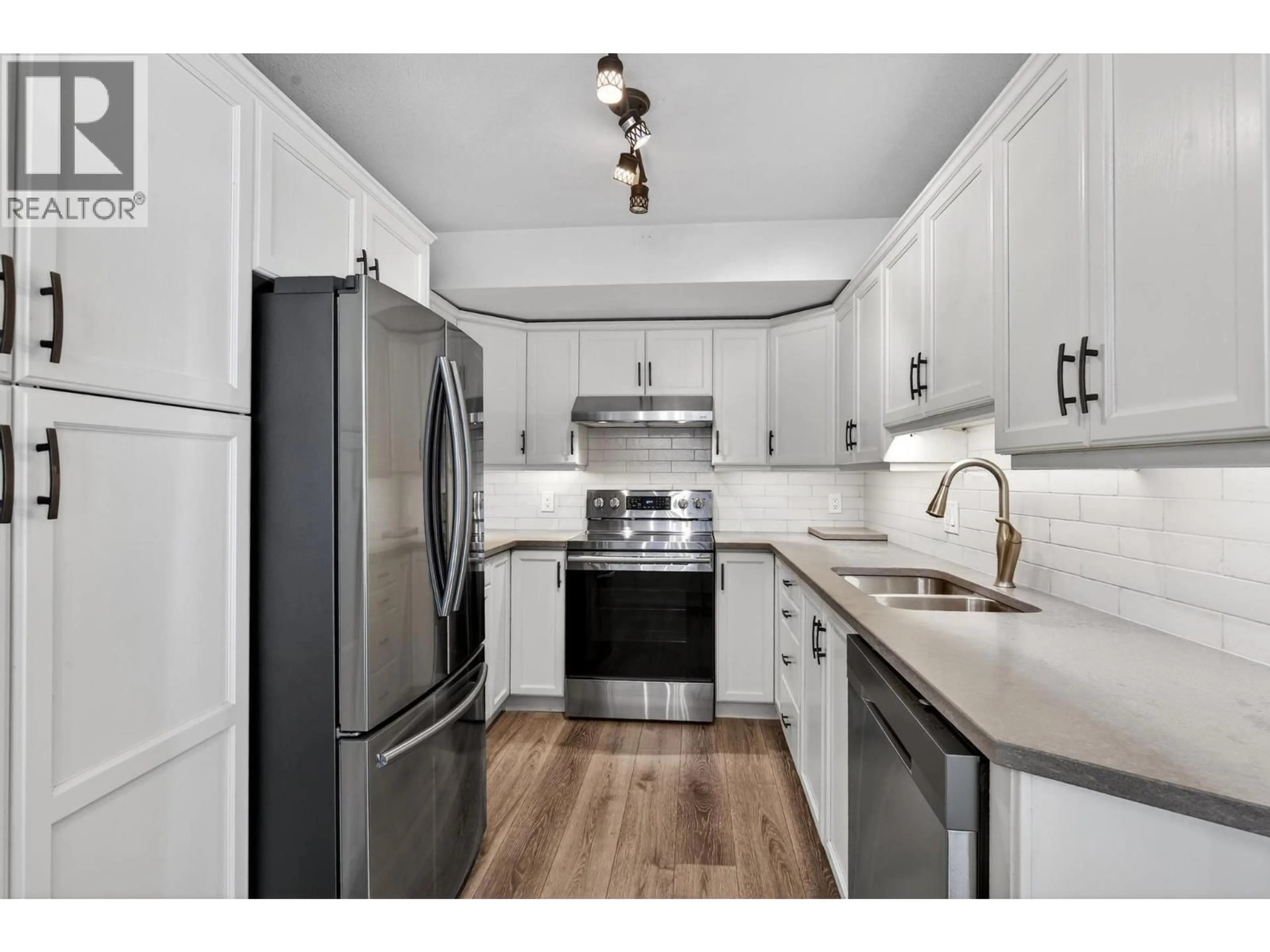 Standard kitchen, wood/laminate floor for 31 - 316 WHITMAN ROAD, Kelowna British Columbia V1V1Y9