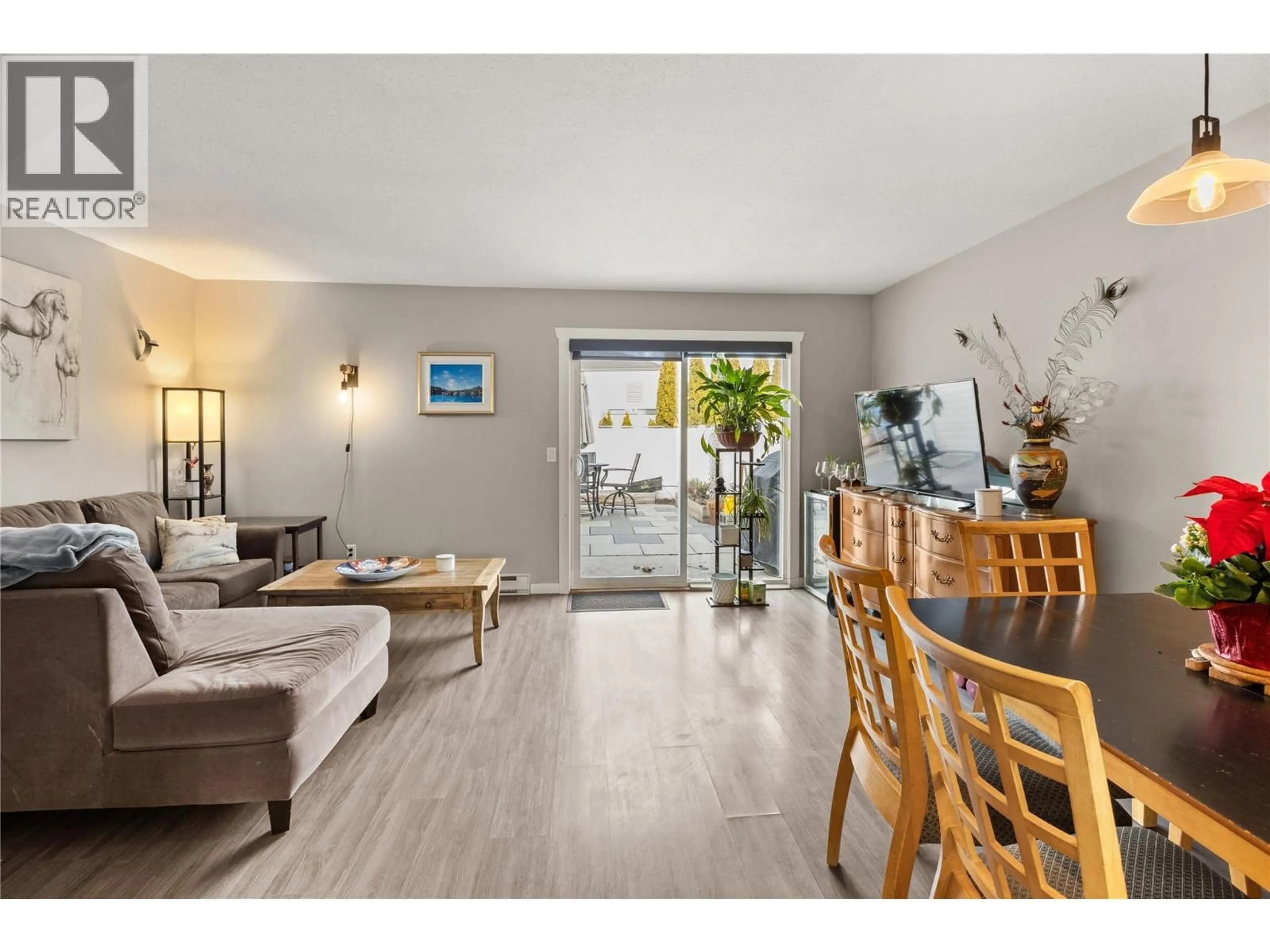 Living room with furniture, wood/laminate floor for 30 - 2250 BASKIN STREET, Penticton British Columbia V2A6Y3
