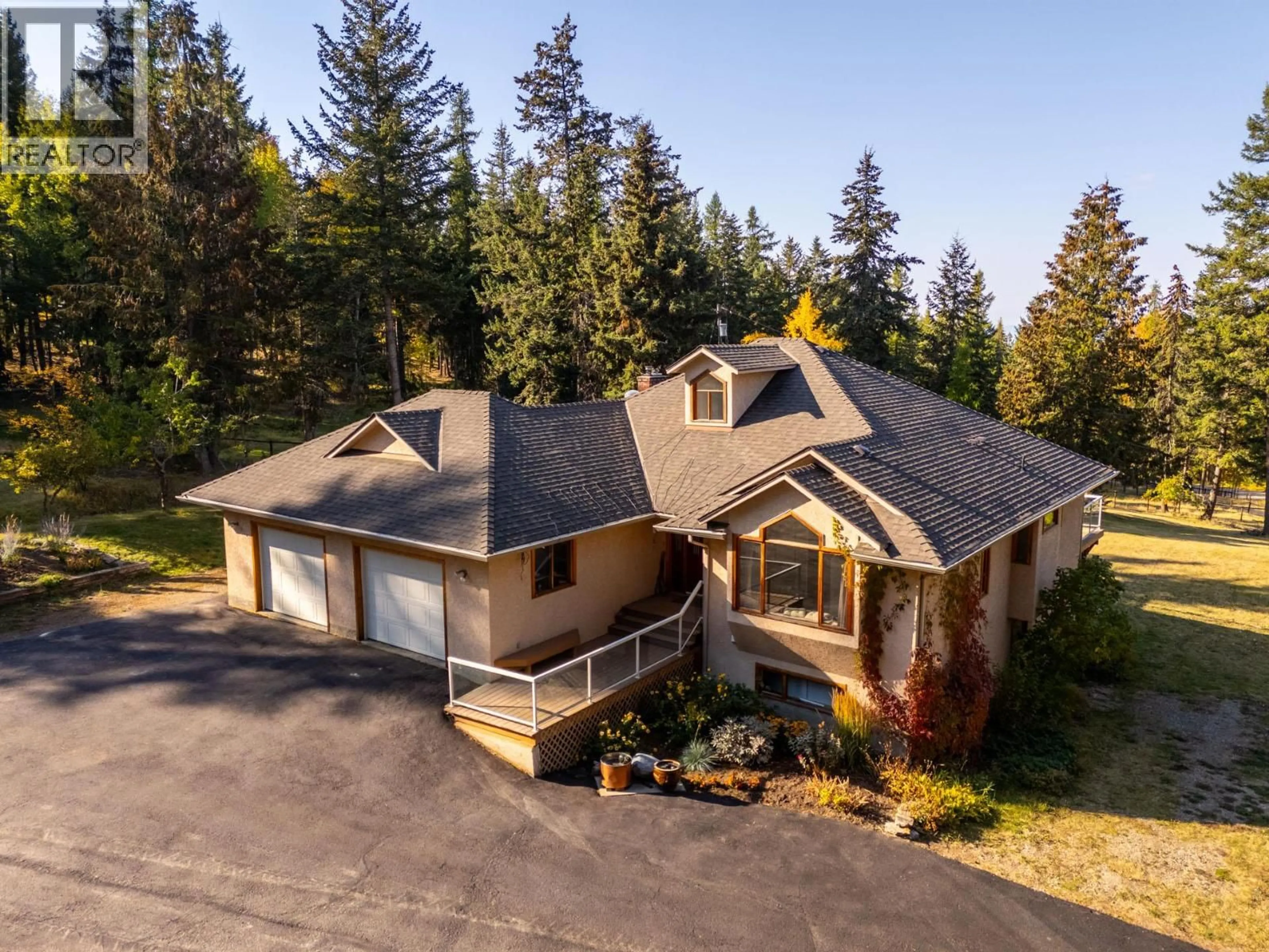 A pic from outside/outdoor area/front of a property/back of a property/a pic from drone, unknown for 2082 HUCKLEBERRY ROAD, Kelowna British Columbia V1P1M4