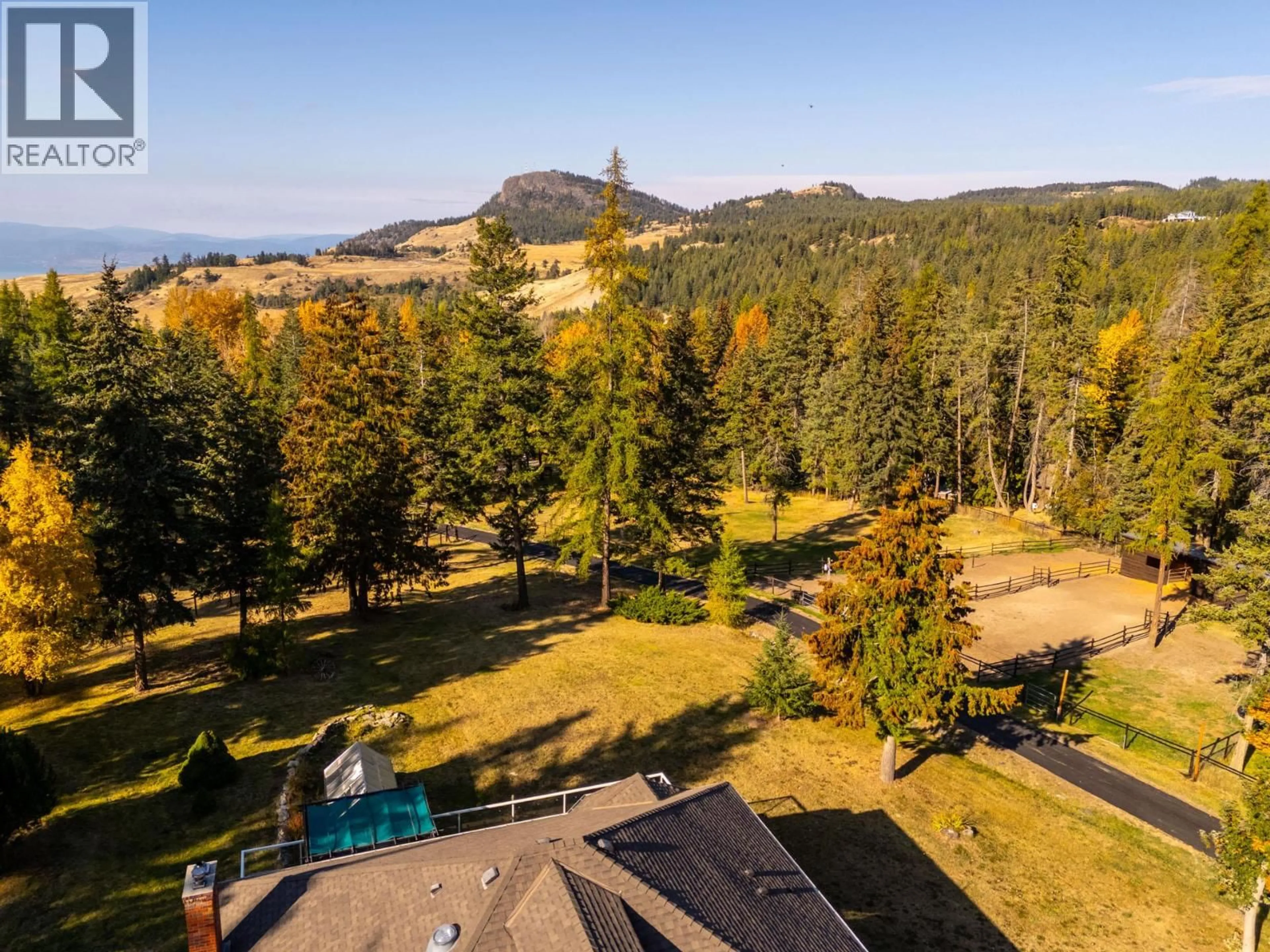 A pic from outside/outdoor area/front of a property/back of a property/a pic from drone, mountain view for 2082 HUCKLEBERRY ROAD, Kelowna British Columbia V1P1M4