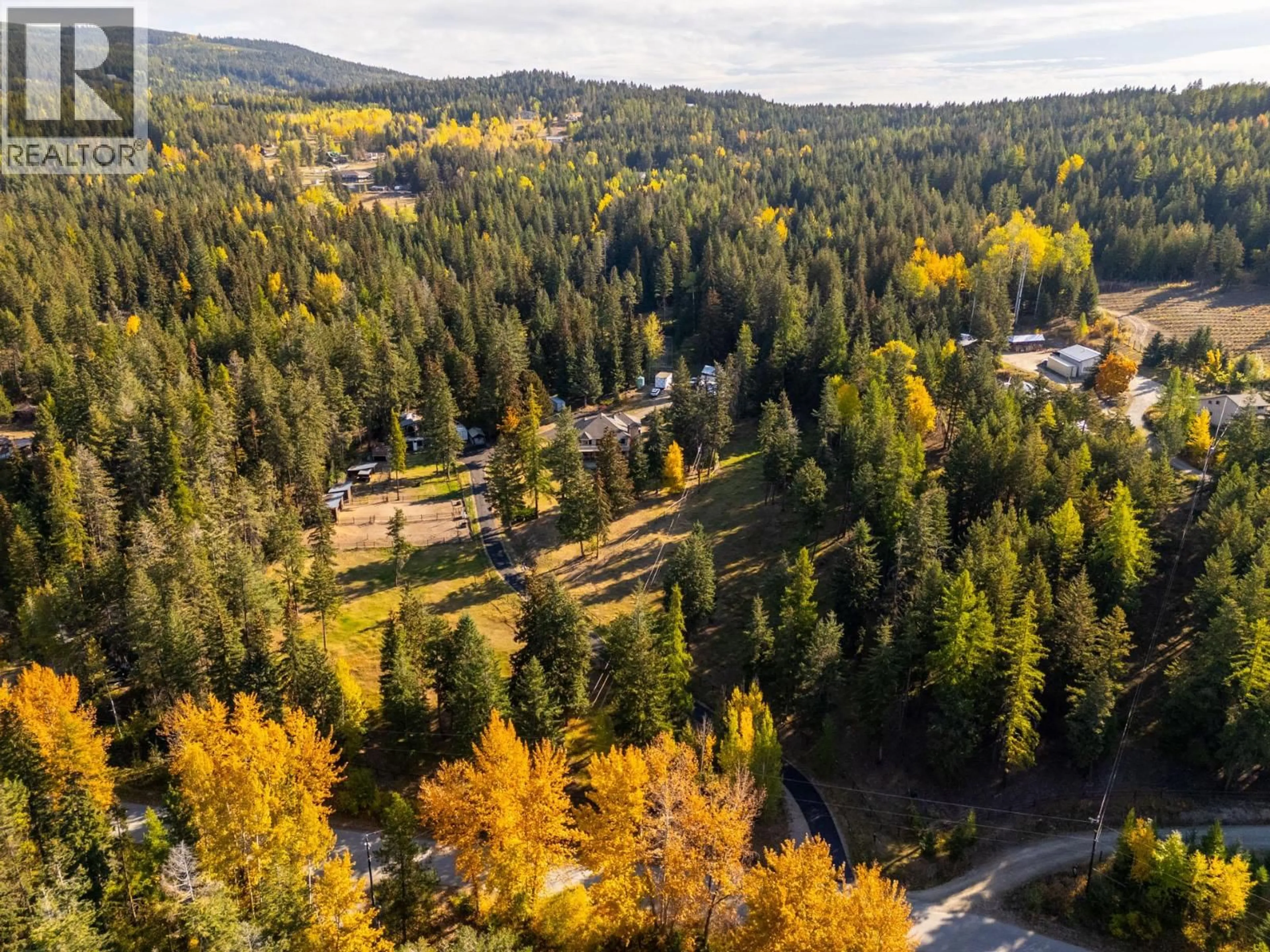 A pic from outside/outdoor area/front of a property/back of a property/a pic from drone, forest/trees view for 2082 HUCKLEBERRY ROAD, Kelowna British Columbia V1P1M4