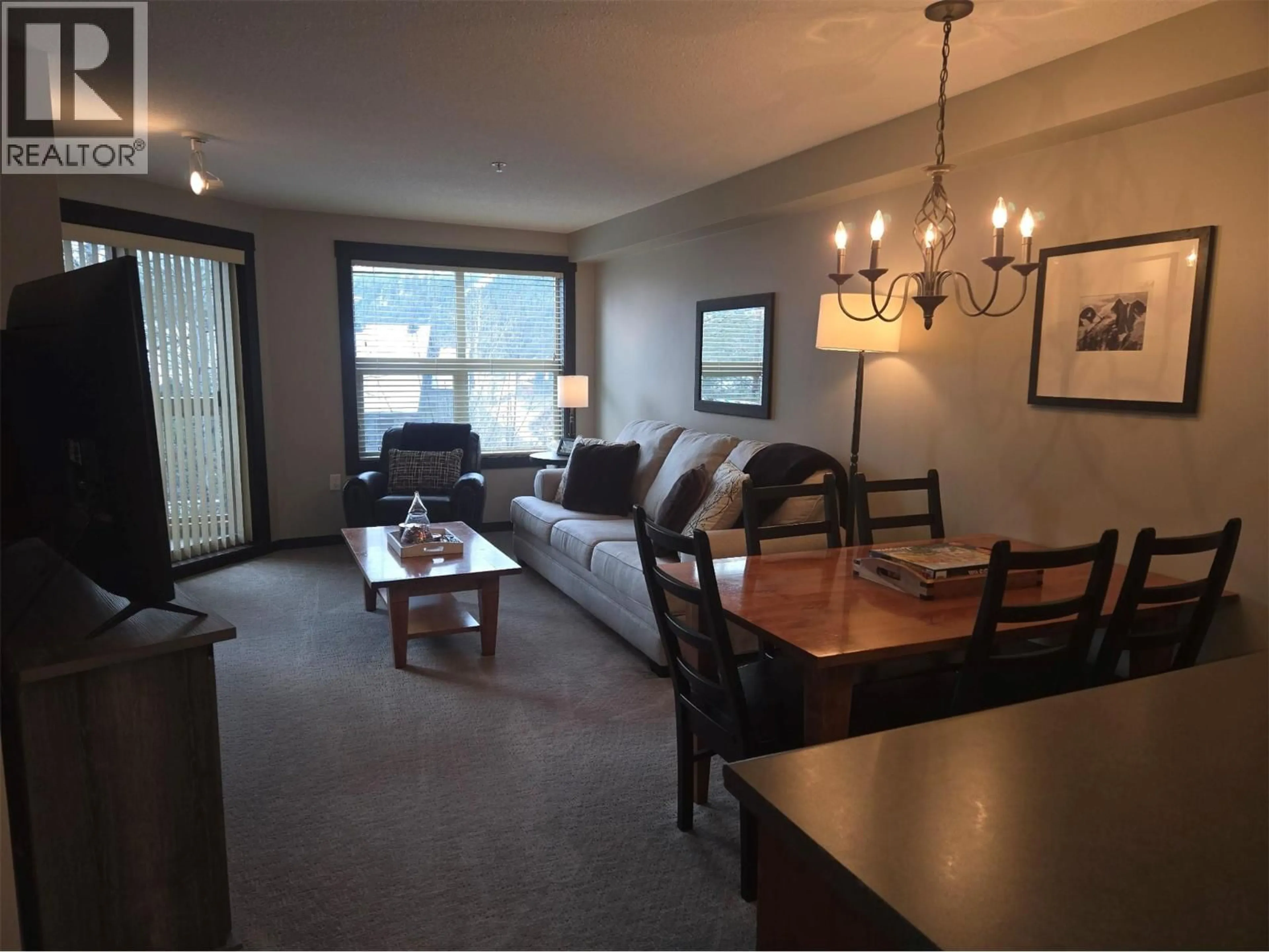 Living room with furniture, wood/laminate floor for 303 - 2070 SUMMIT DRIVE, Panorama British Columbia V0A1T0
