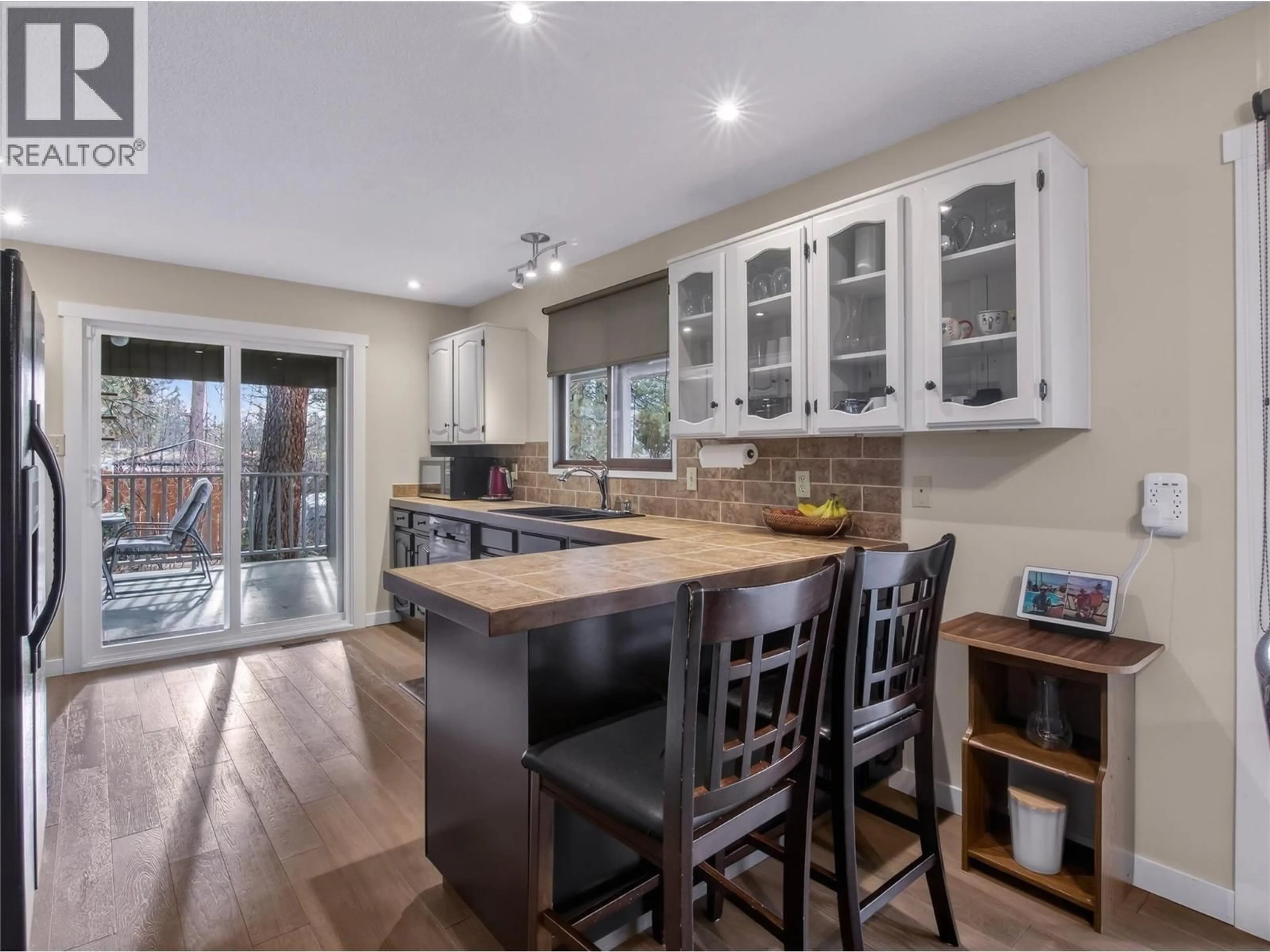 Open concept kitchen, wood/laminate floor for 130 LAUREL PLACE, Penticton British Columbia V2A7S7