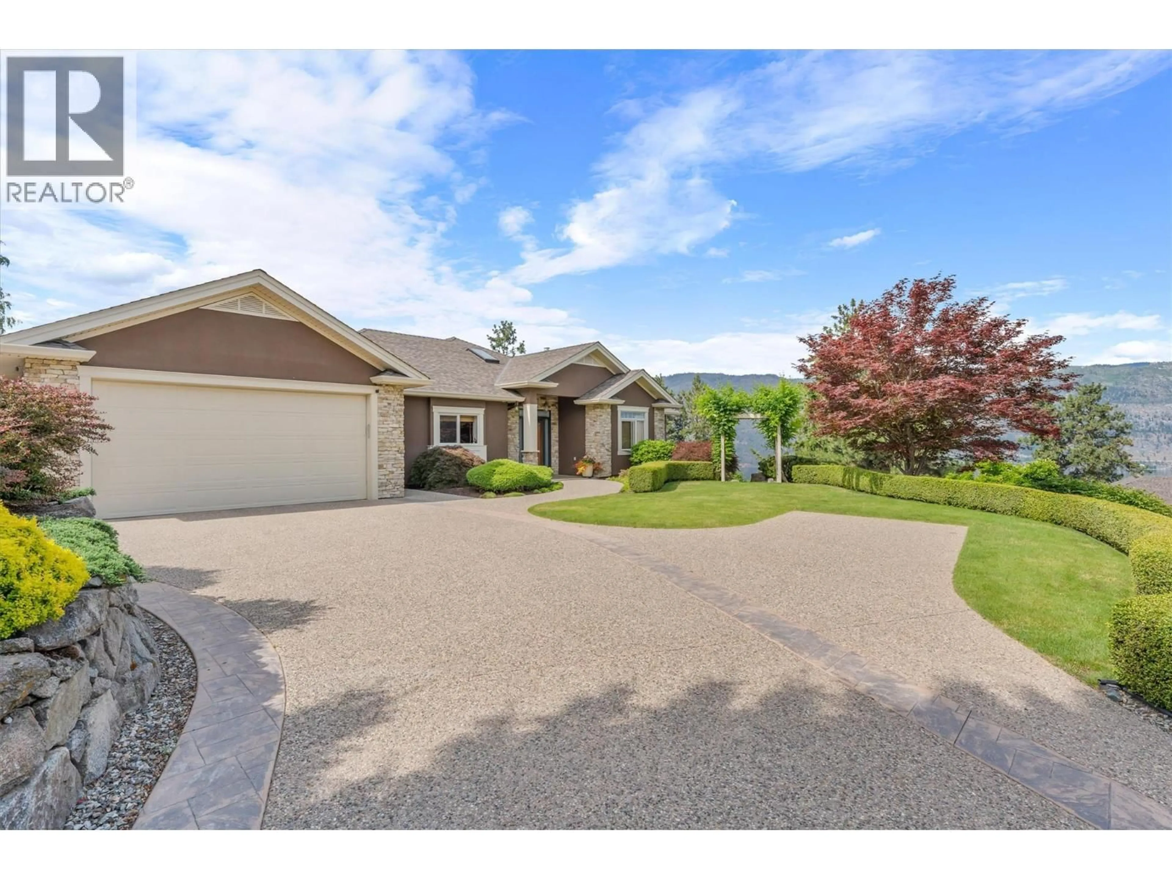 A pic from outside/outdoor area/front of a property/back of a property/a pic from drone, street for 30 - 10726 NIGHTHAWK ROAD, Lake Country British Columbia V4V2K7