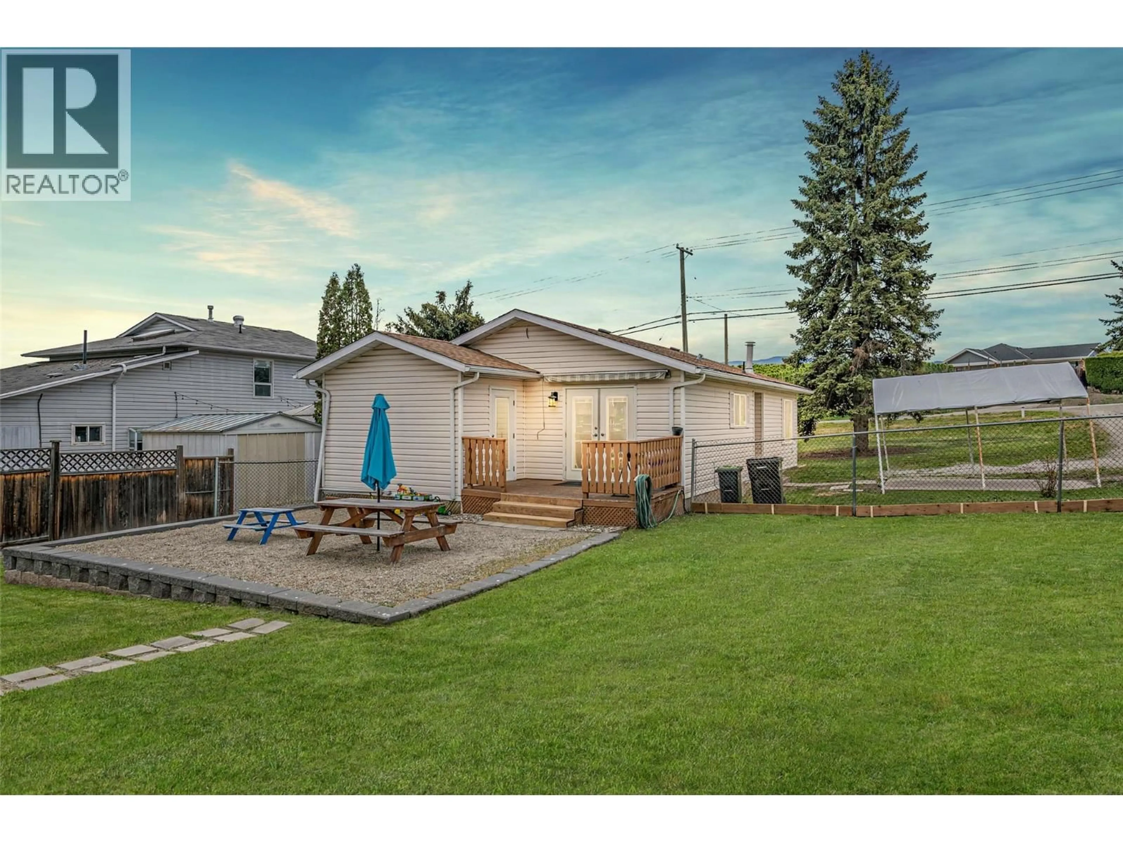 A pic from outside/outdoor area/front of a property/back of a property/a pic from drone, unknown for 6111 BELLA VISTA ROAD, Vernon British Columbia V1H1B4
