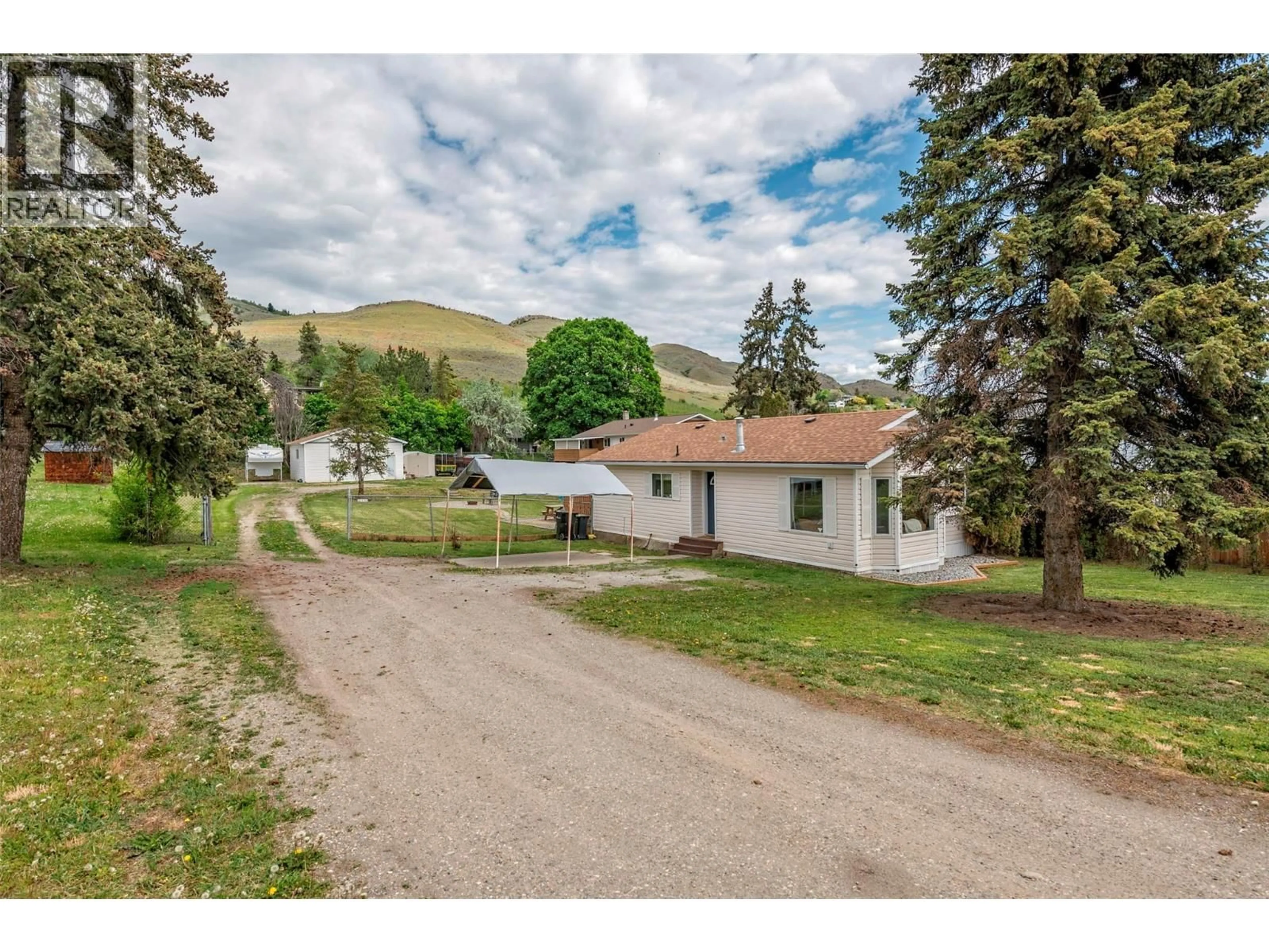 A pic from outside/outdoor area/front of a property/back of a property/a pic from drone, mountain view for 6111 BELLA VISTA ROAD, Vernon British Columbia V1H1B4