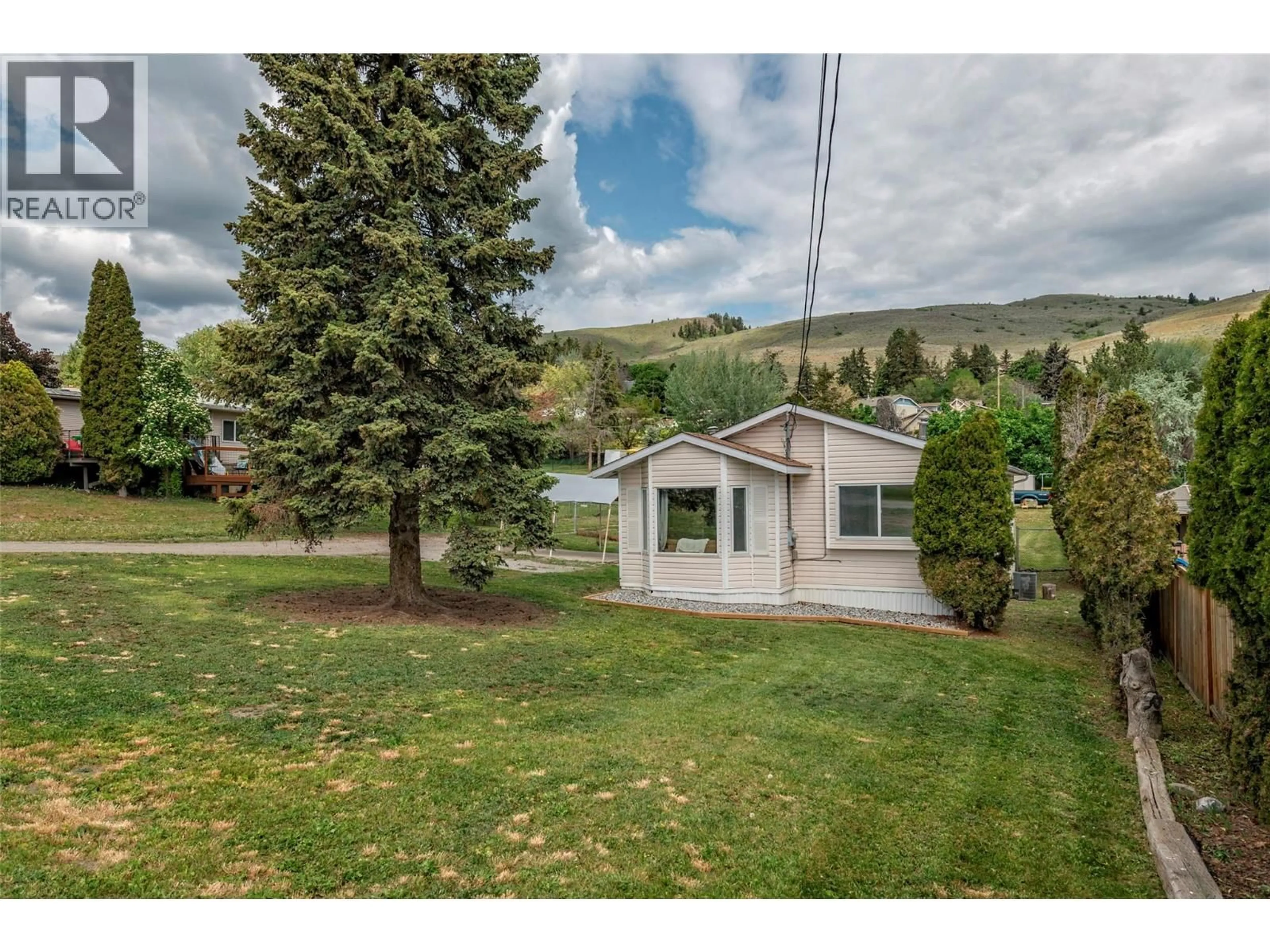 A pic from outside/outdoor area/front of a property/back of a property/a pic from drone, mountain view for 6111 BELLA VISTA ROAD, Vernon British Columbia V1H1B4