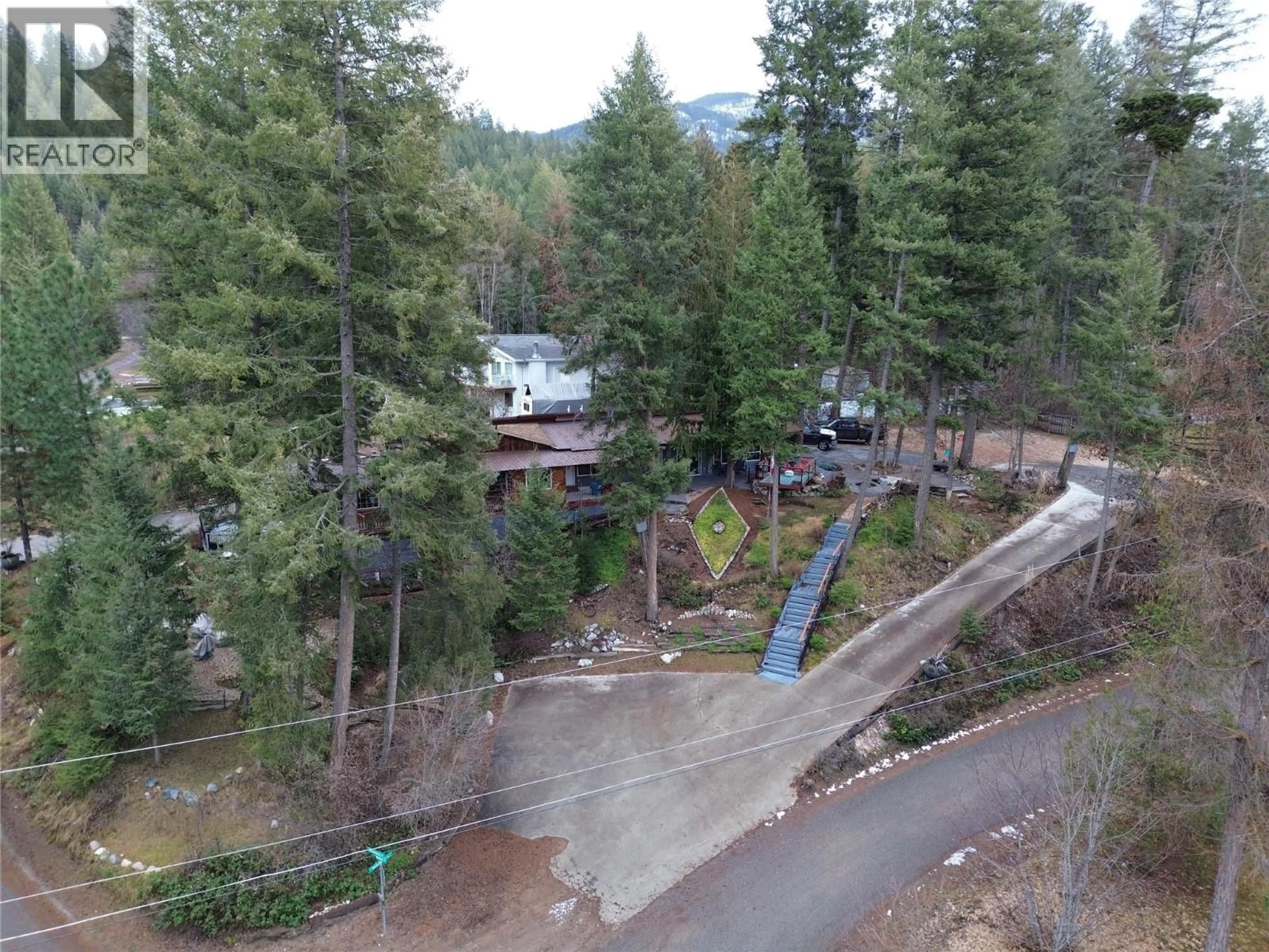 A pic from outside/outdoor area/front of a property/back of a property/a pic from drone, forest/trees view for 39 WILKENSON ROAD, Christina Lake British Columbia V0H1E2