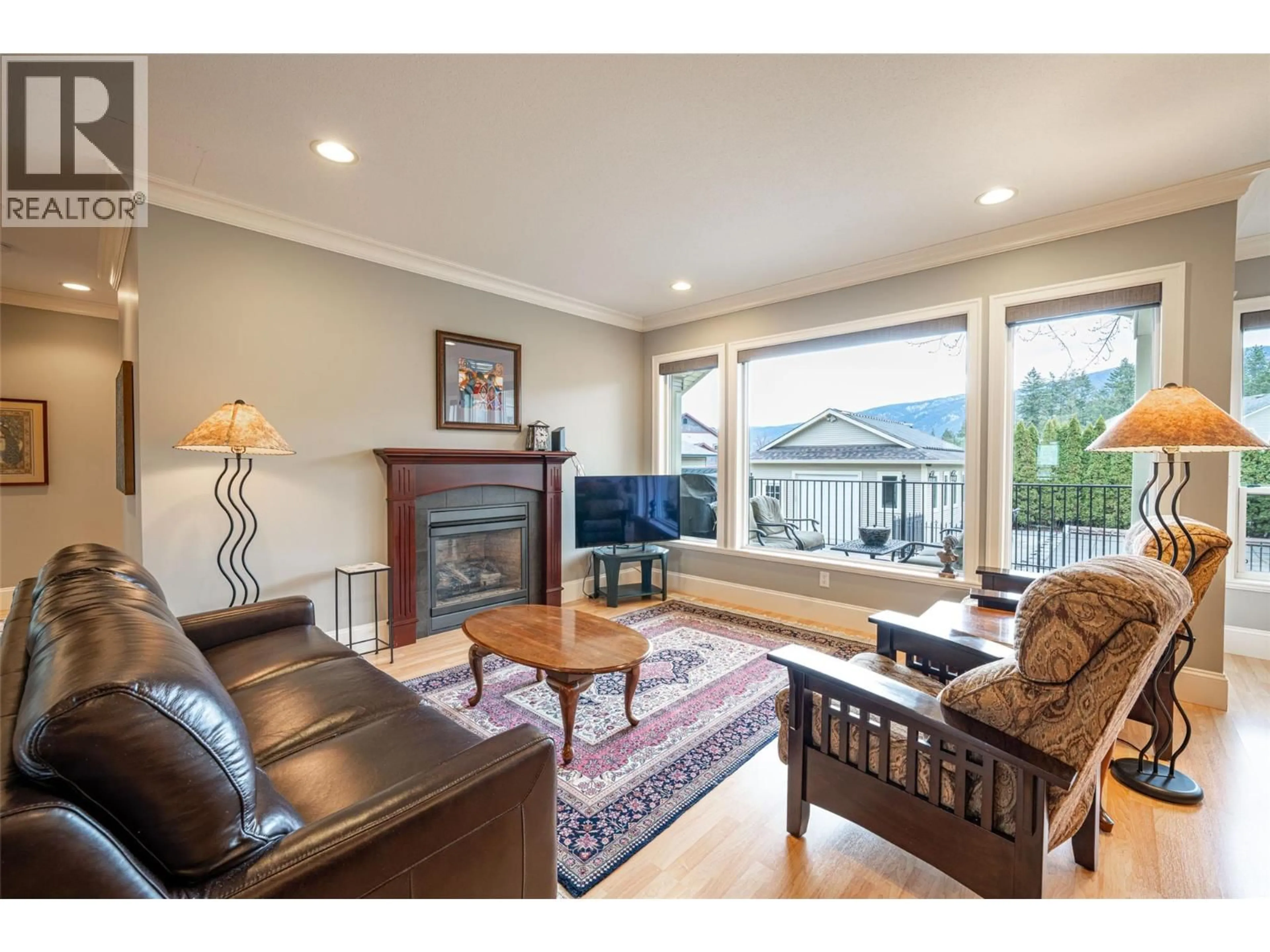 Living room with furniture, wood/laminate floor for 2540 COLONY STREET, Armstrong British Columbia V4Y0H6