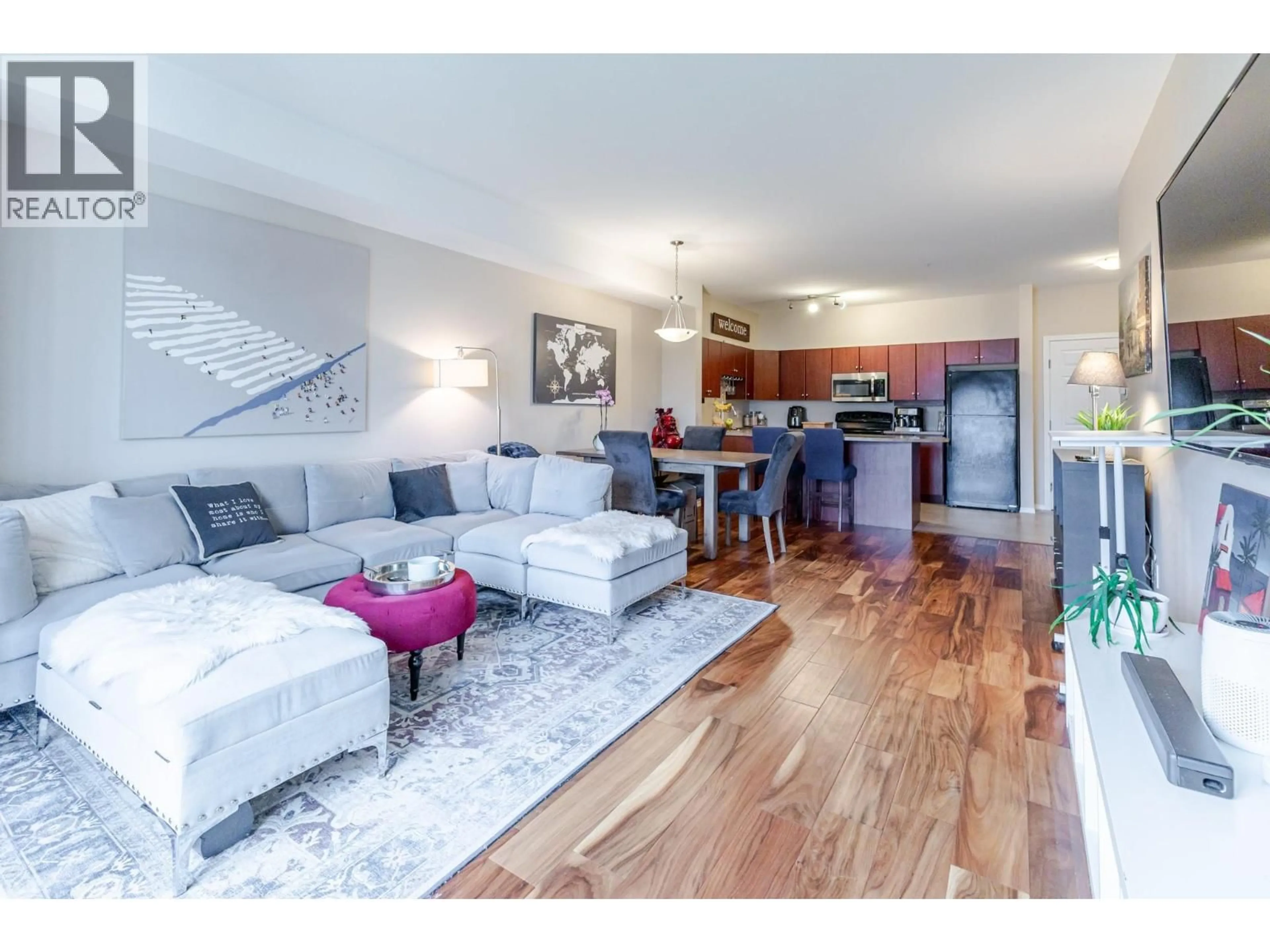 Living room with furniture, wood/laminate floor for 1516 - 1875 COUNTRY CLUB DRIVE, Kelowna British Columbia V1V2W7