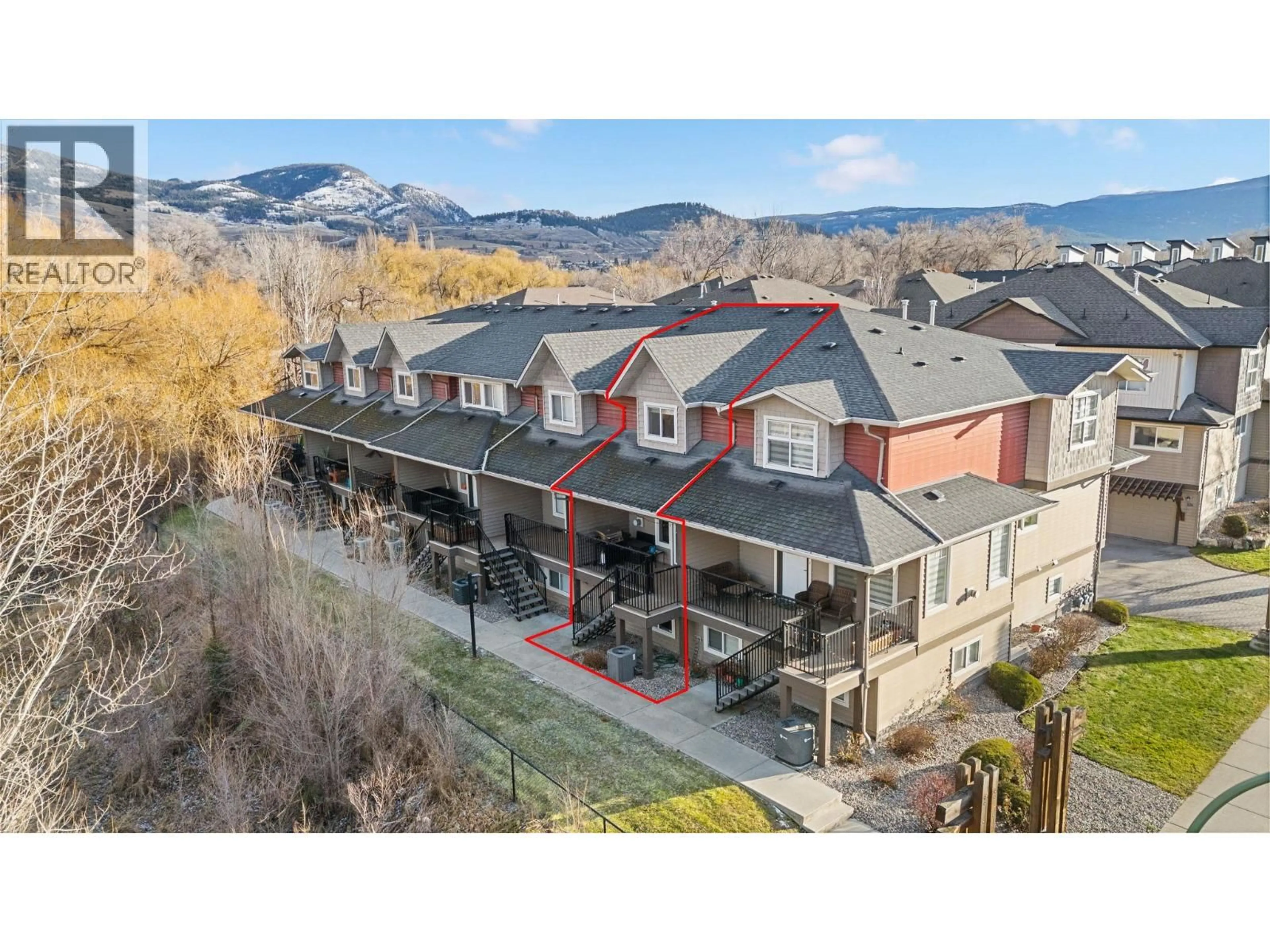 A pic from outside/outdoor area/front of a property/back of a property/a pic from drone, mountain view for 128 - 1355 FINDLAY ROAD, Kelowna British Columbia V1X8B8