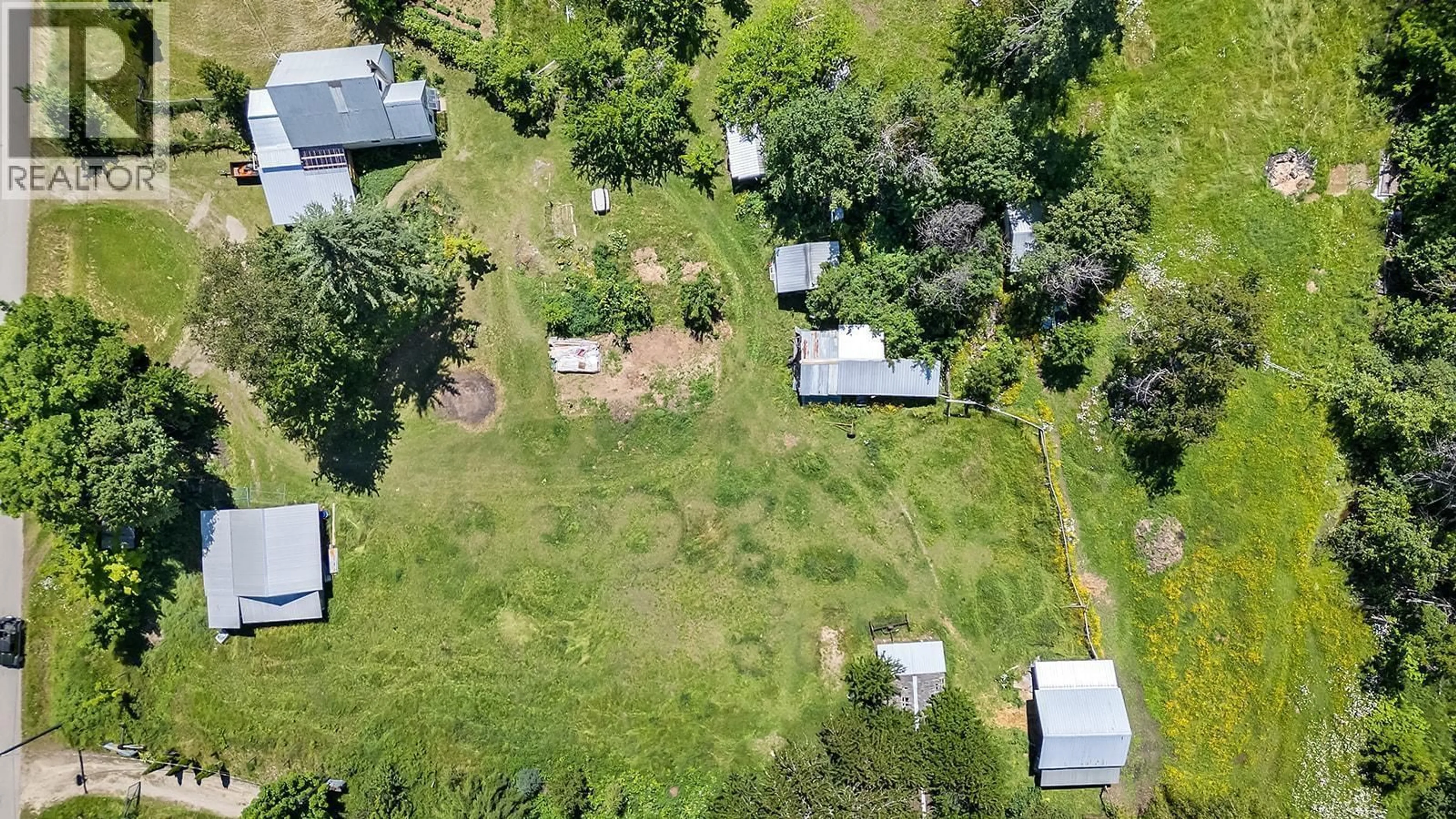 A pic from outside/outdoor area/front of a property/back of a property/a pic from drone, street for 15781 PETERS ROAD, Crawford Bay British Columbia V0B1E0