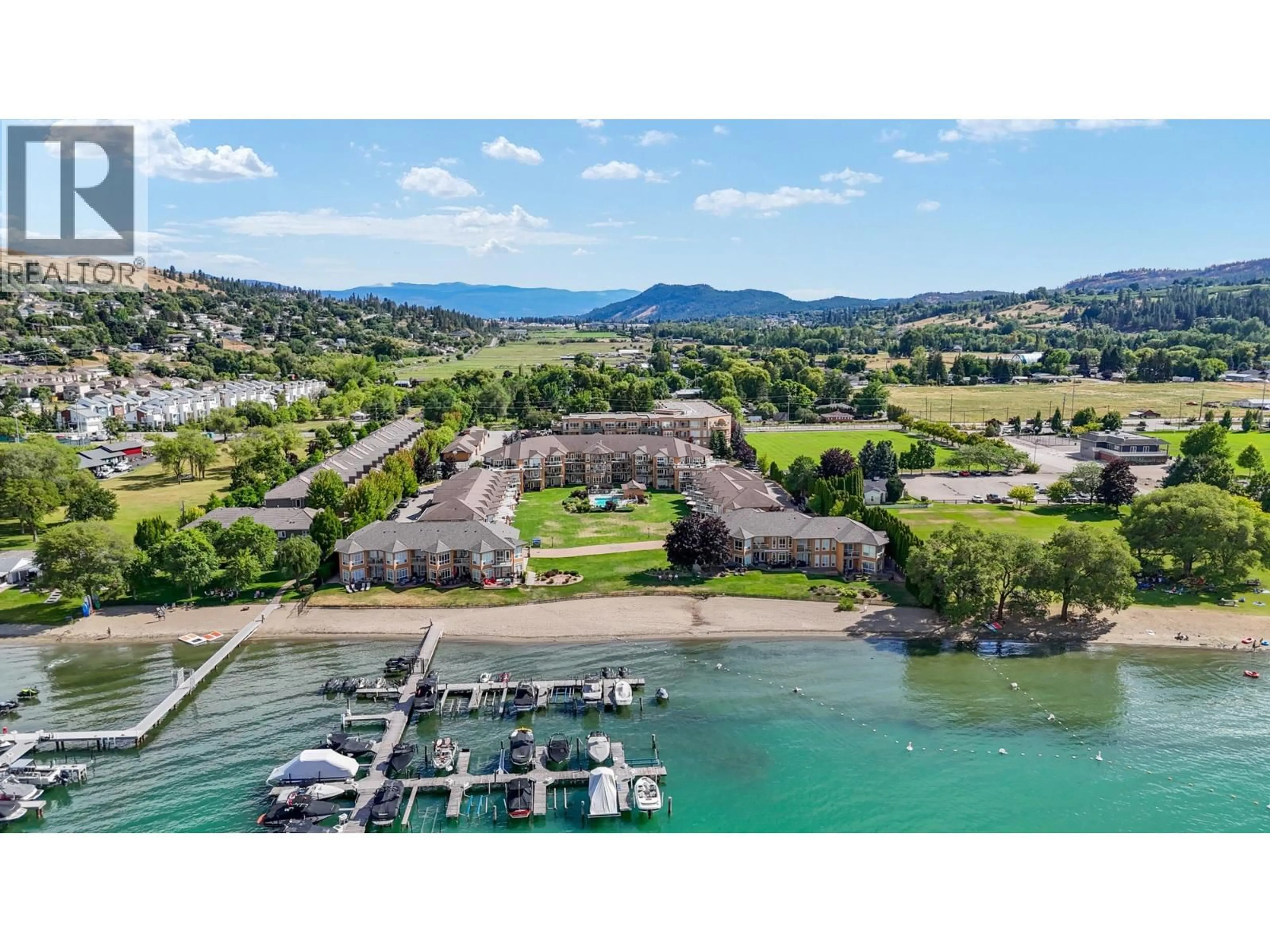 A pic from outside/outdoor area/front of a property/back of a property/a pic from drone, water/lake/river/ocean view for 303 - 3570 WOODSDALE ROAD, Lake Country British Columbia V4V1Y9