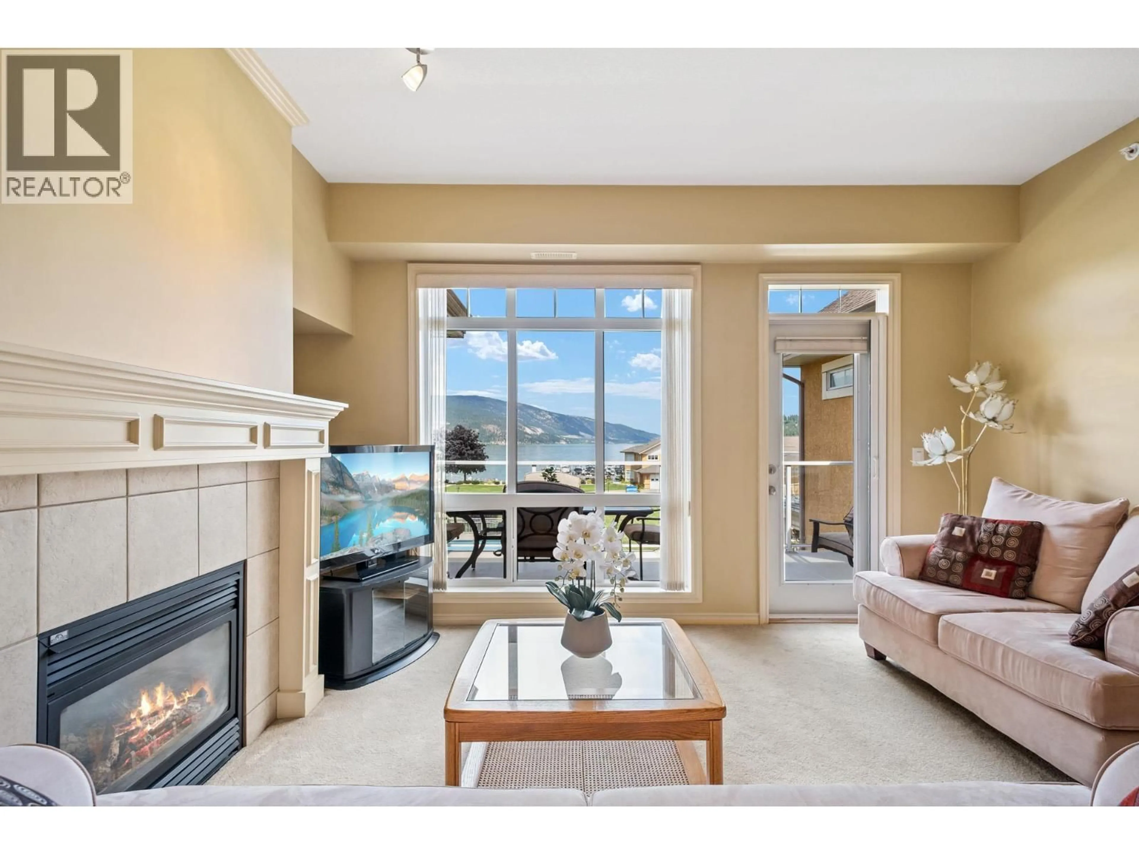 Living room with furniture, ceramic/tile floor for 303 - 3570 WOODSDALE ROAD, Lake Country British Columbia V4V1Y9