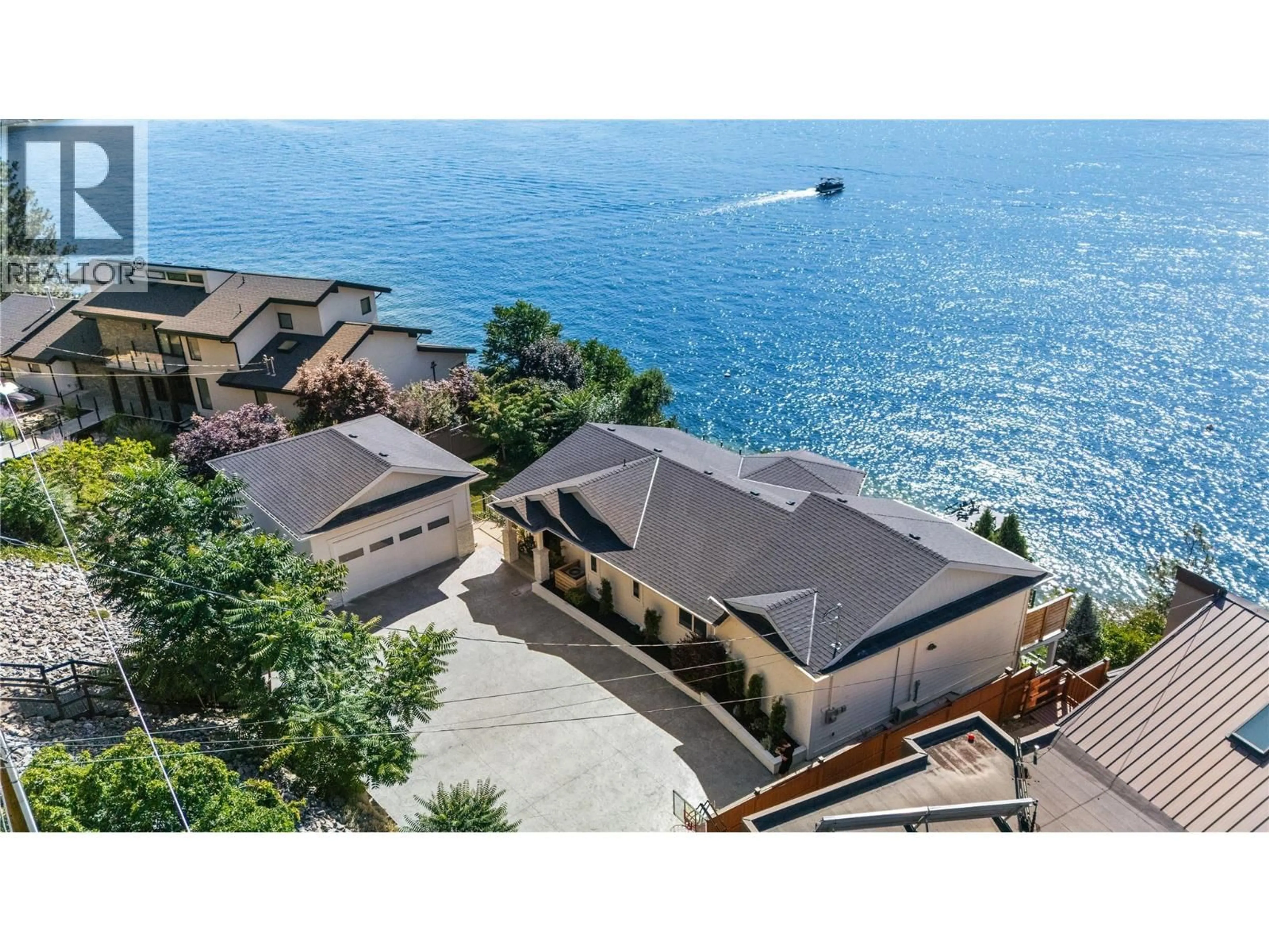 A pic from outside/outdoor area/front of a property/back of a property/a pic from drone, water/lake/river/ocean view for 1876 DEWDNEY ROAD, Kelowna British Columbia V1V2C3