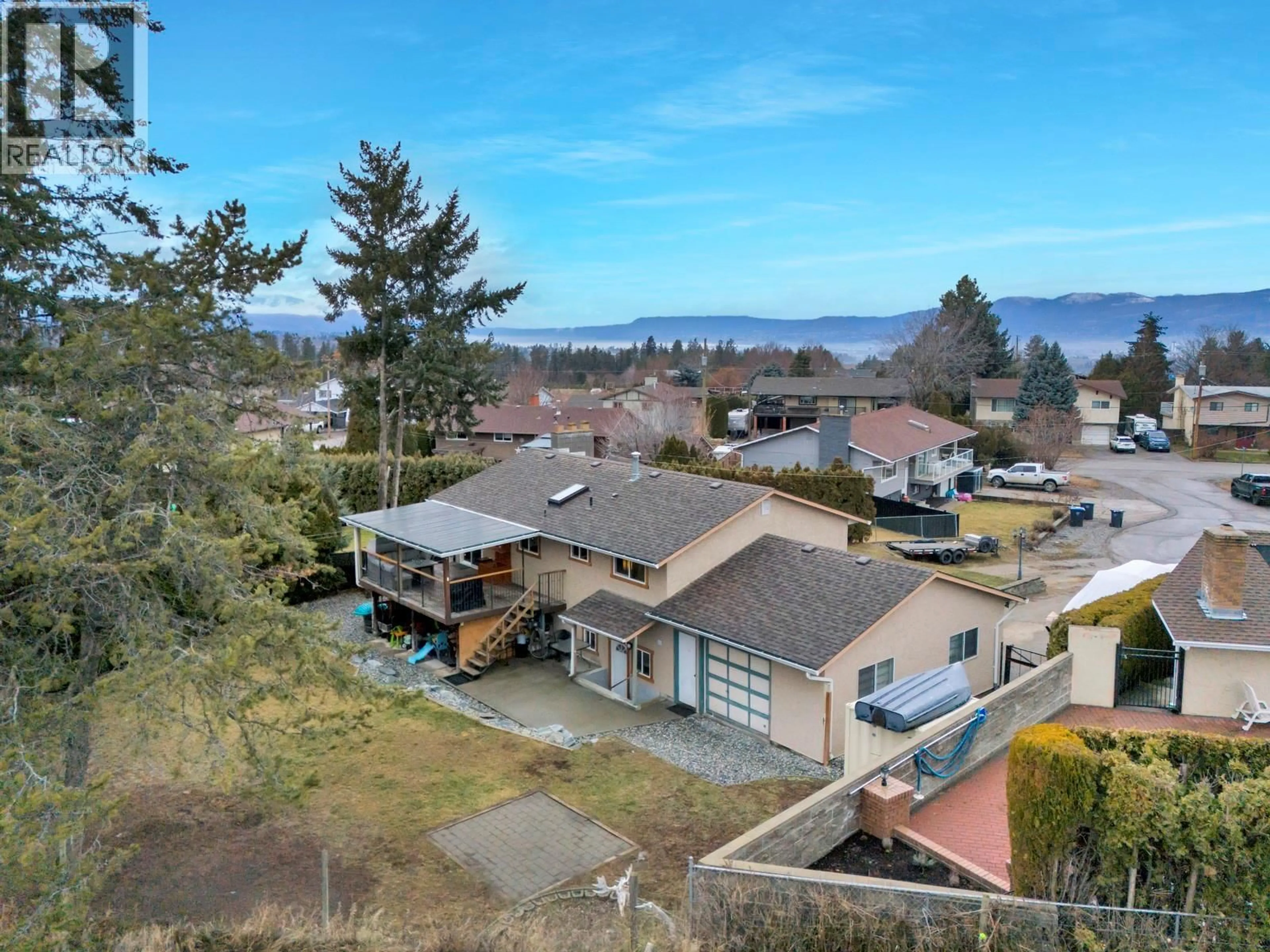 A pic from outside/outdoor area/front of a property/back of a property/a pic from drone, water/lake/river/ocean view for 1653 TRAUT COURT, Kelowna British Columbia V1P1E6