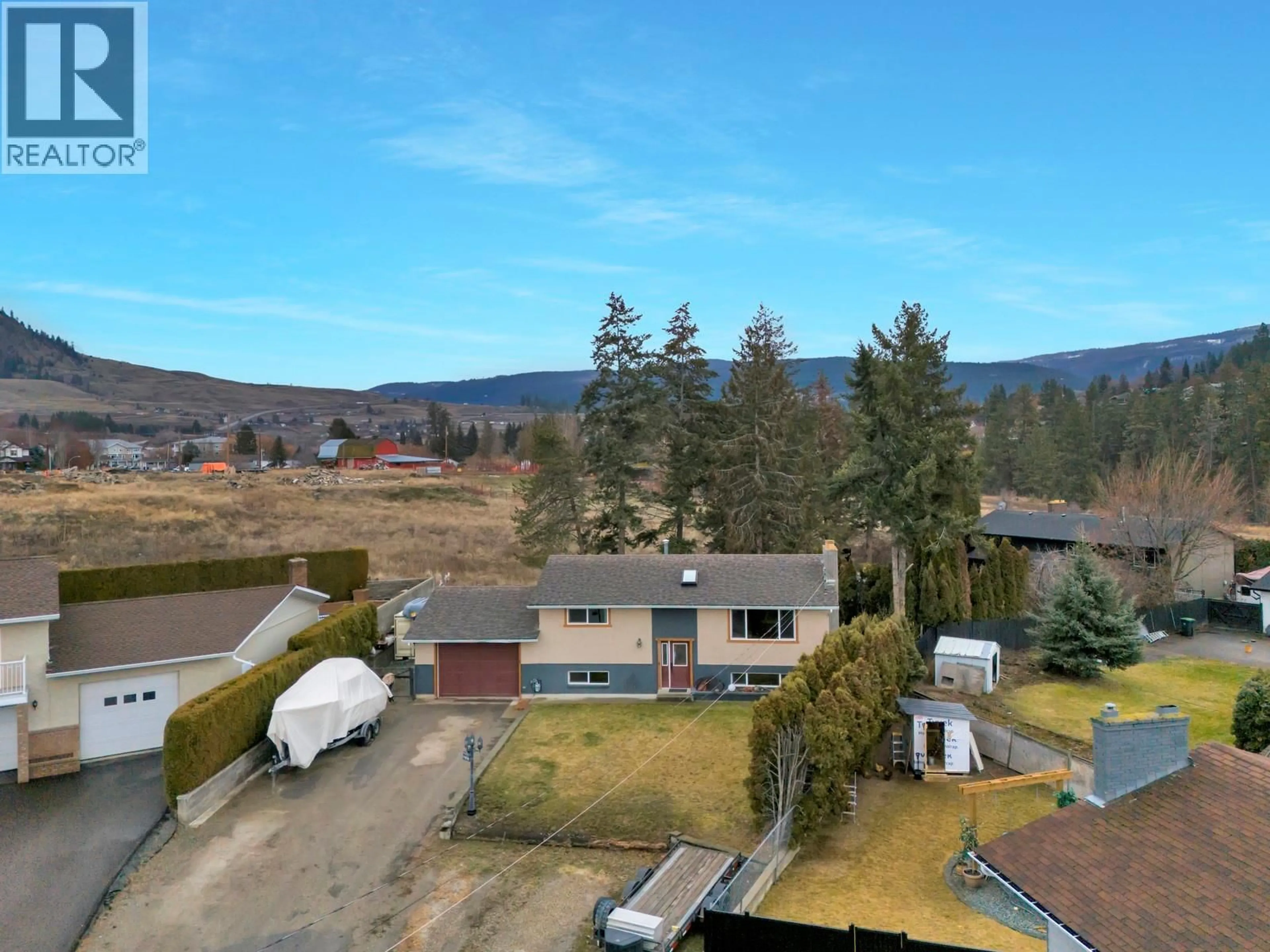 A pic from outside/outdoor area/front of a property/back of a property/a pic from drone, mountain view for 1653 TRAUT COURT, Kelowna British Columbia V1P1E6