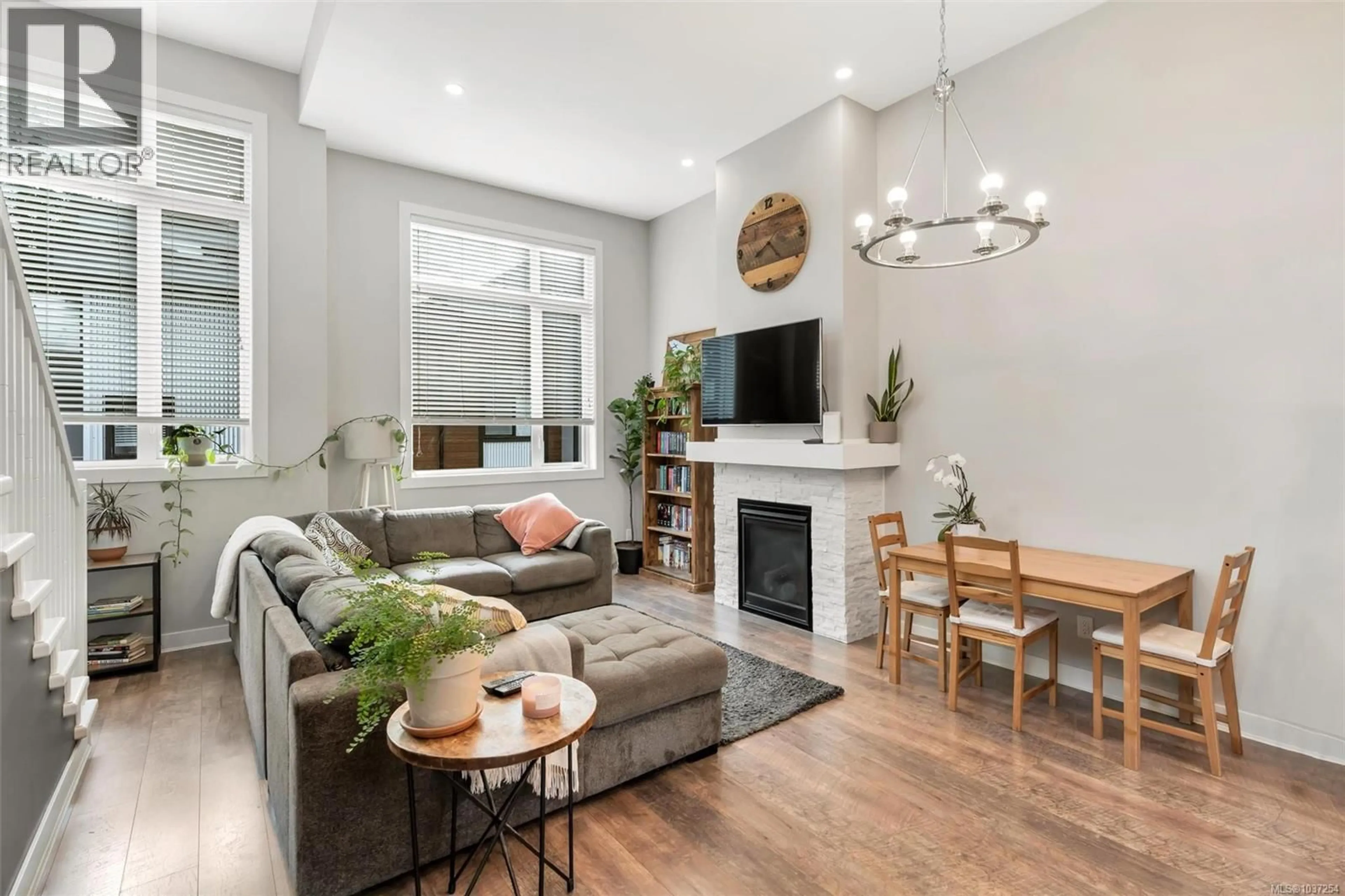 Living room with furniture, wood/laminate floor for 103 - 1202 NOVA COURT, Langford British Columbia V9B0T7