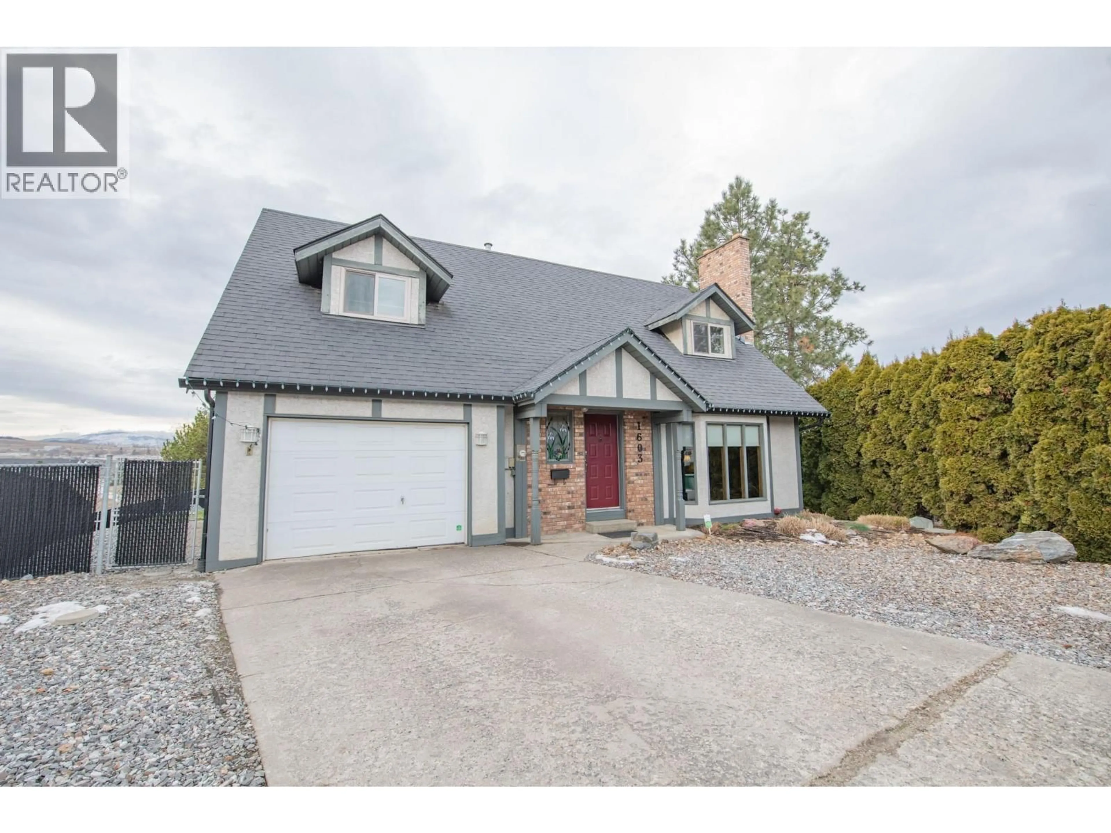 Home with vinyl exterior material, street for 1603 18 AVENUE, Vernon British Columbia V1T8L7