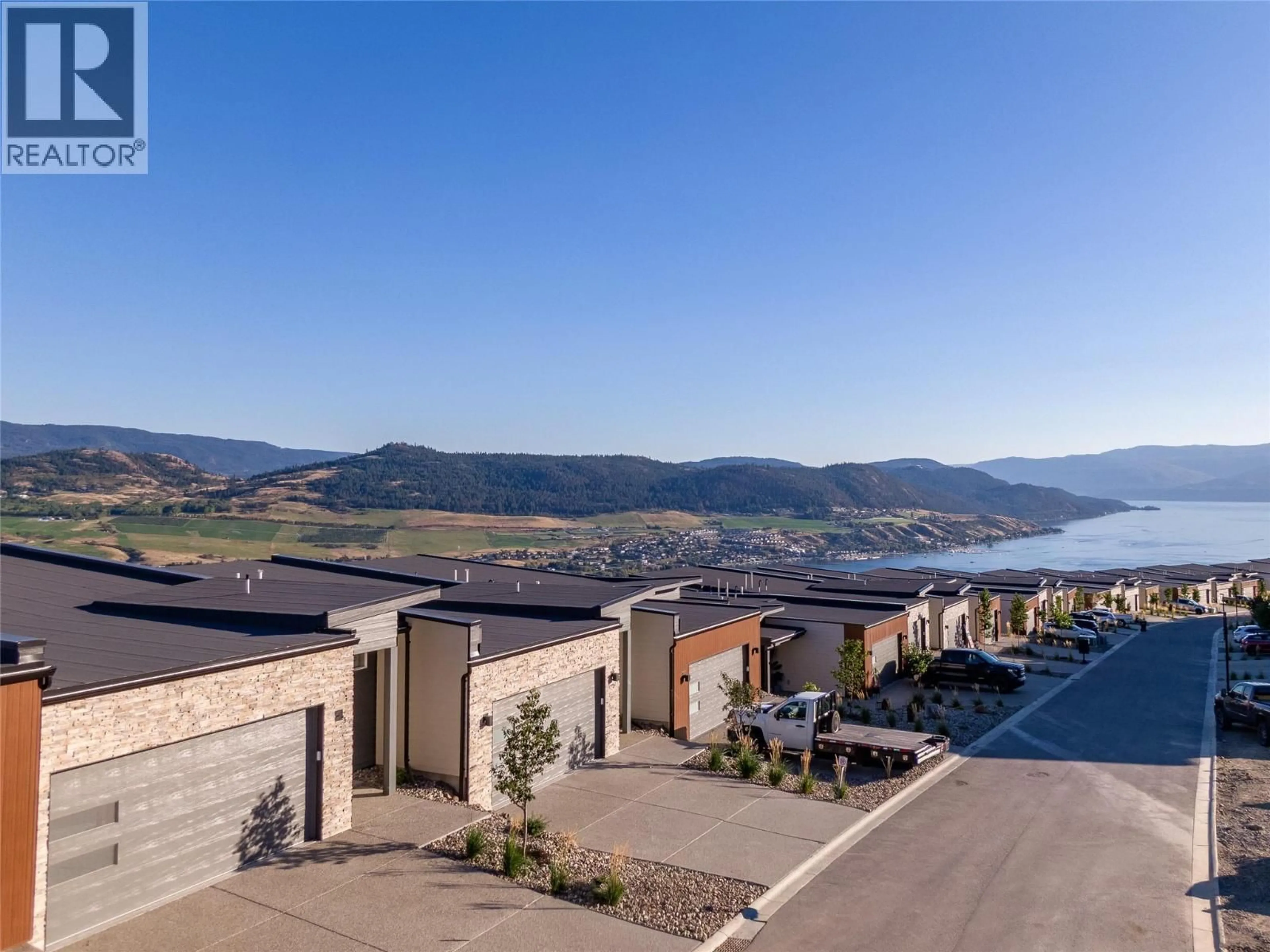 A pic from outside/outdoor area/front of a property/back of a property/a pic from drone, mountain view for 68 - 7735 OKANAGAN HILLS BOULEVARD, Vernon British Columbia V1H0A7