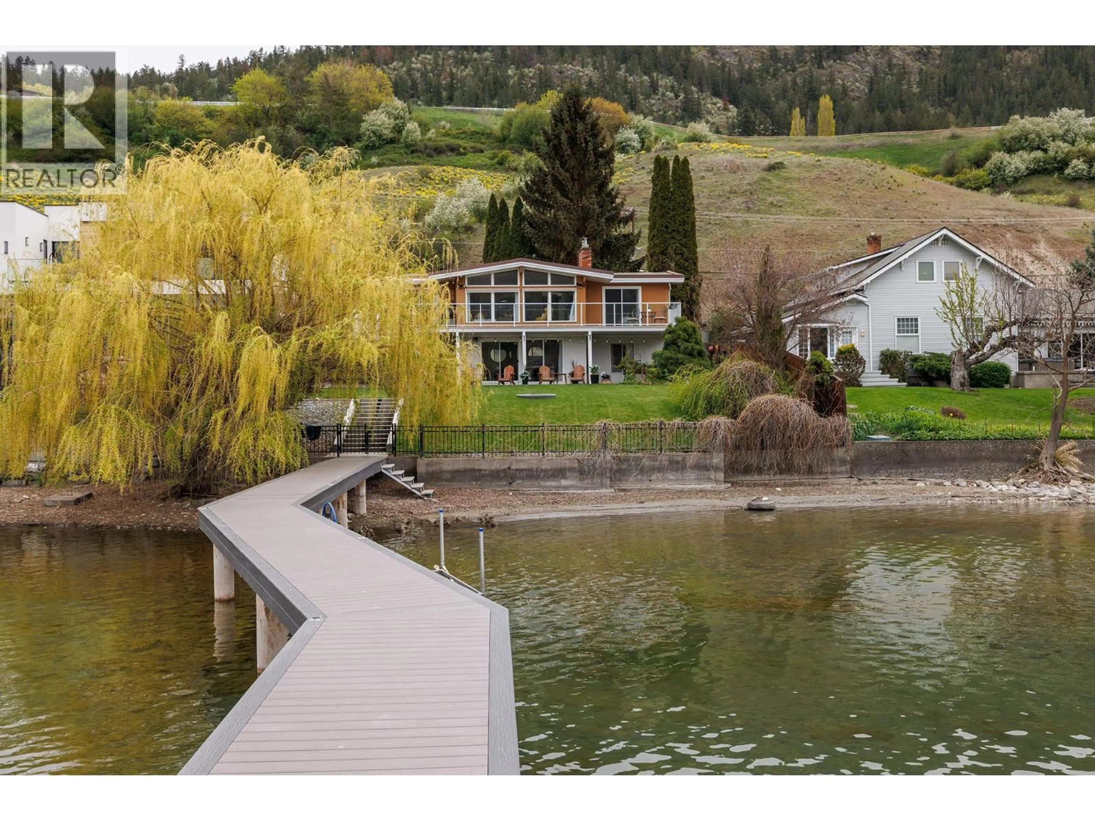 A pic from outside/outdoor area/front of a property/back of a property/a pic from drone, water/lake/river/ocean view for 8291 OKANAGAN LANDING ROAD, Vernon British Columbia V1H1J5