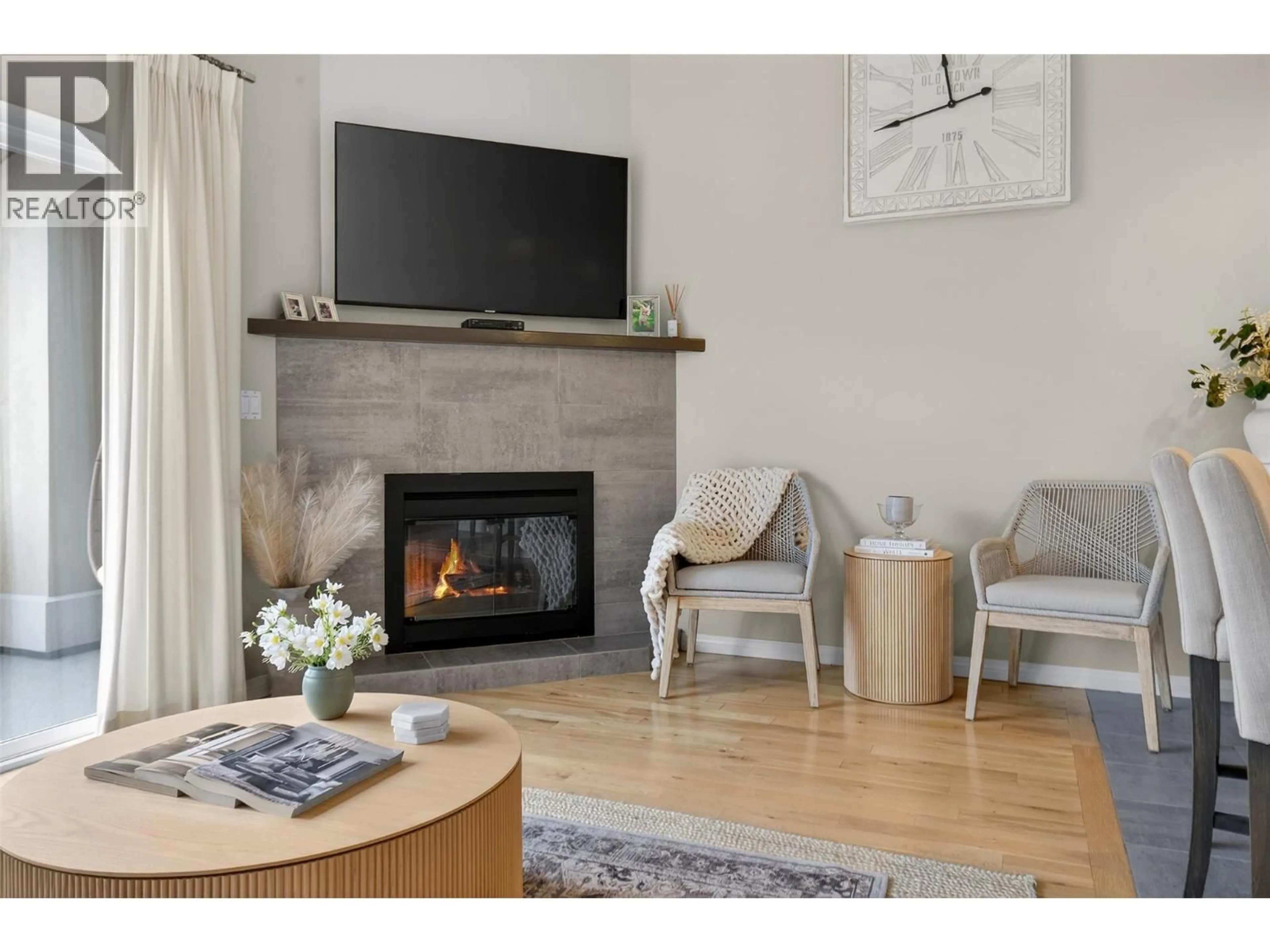 Living room with furniture, wood/laminate floor for 2314 COUNTRY CLUB DRIVE, Kelowna British Columbia V1V2A6