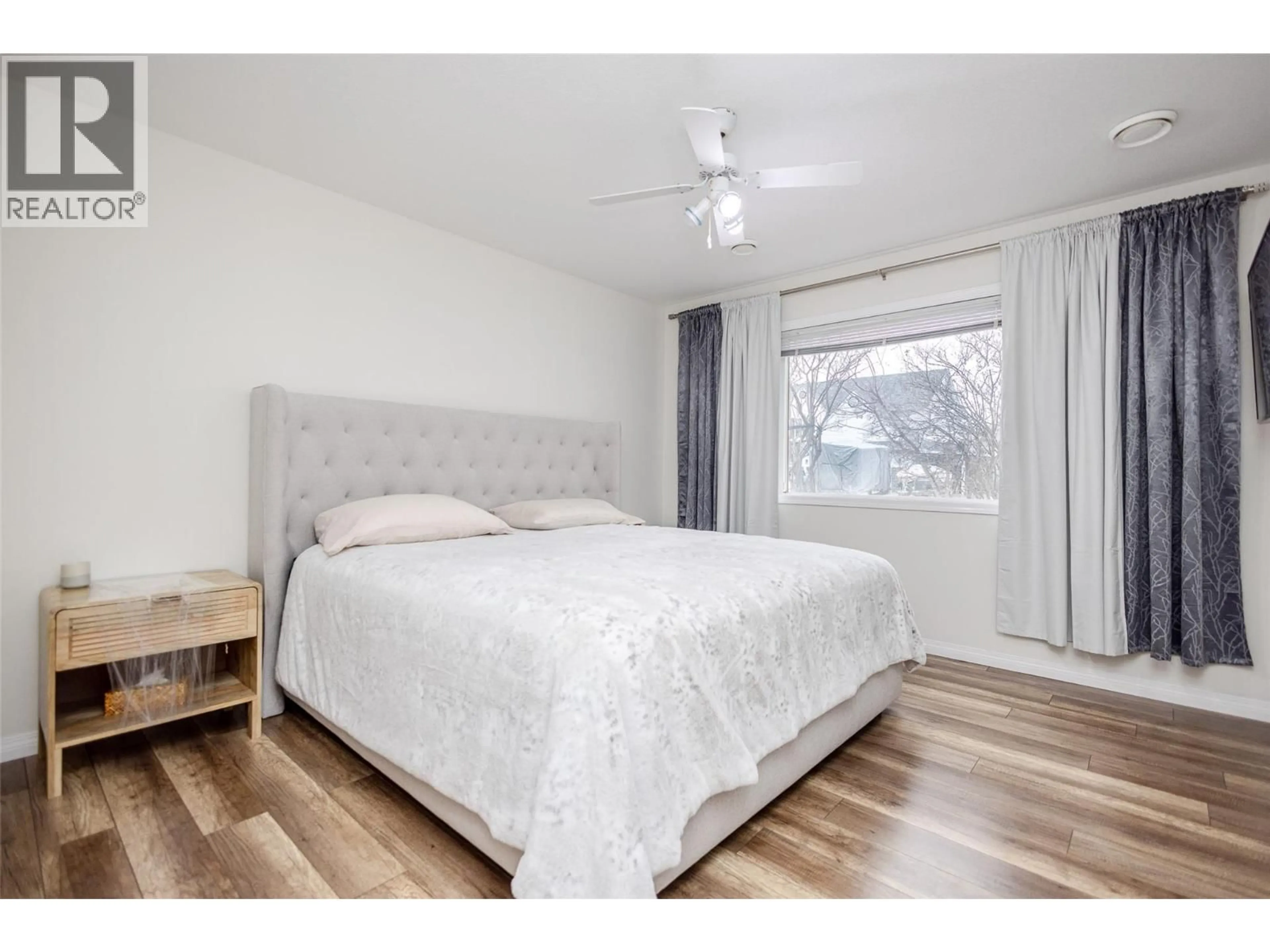 Bedroom with bed, wood/laminate floor for 540 KLASSEN ROAD, Kelowna British Columbia V1X7P3