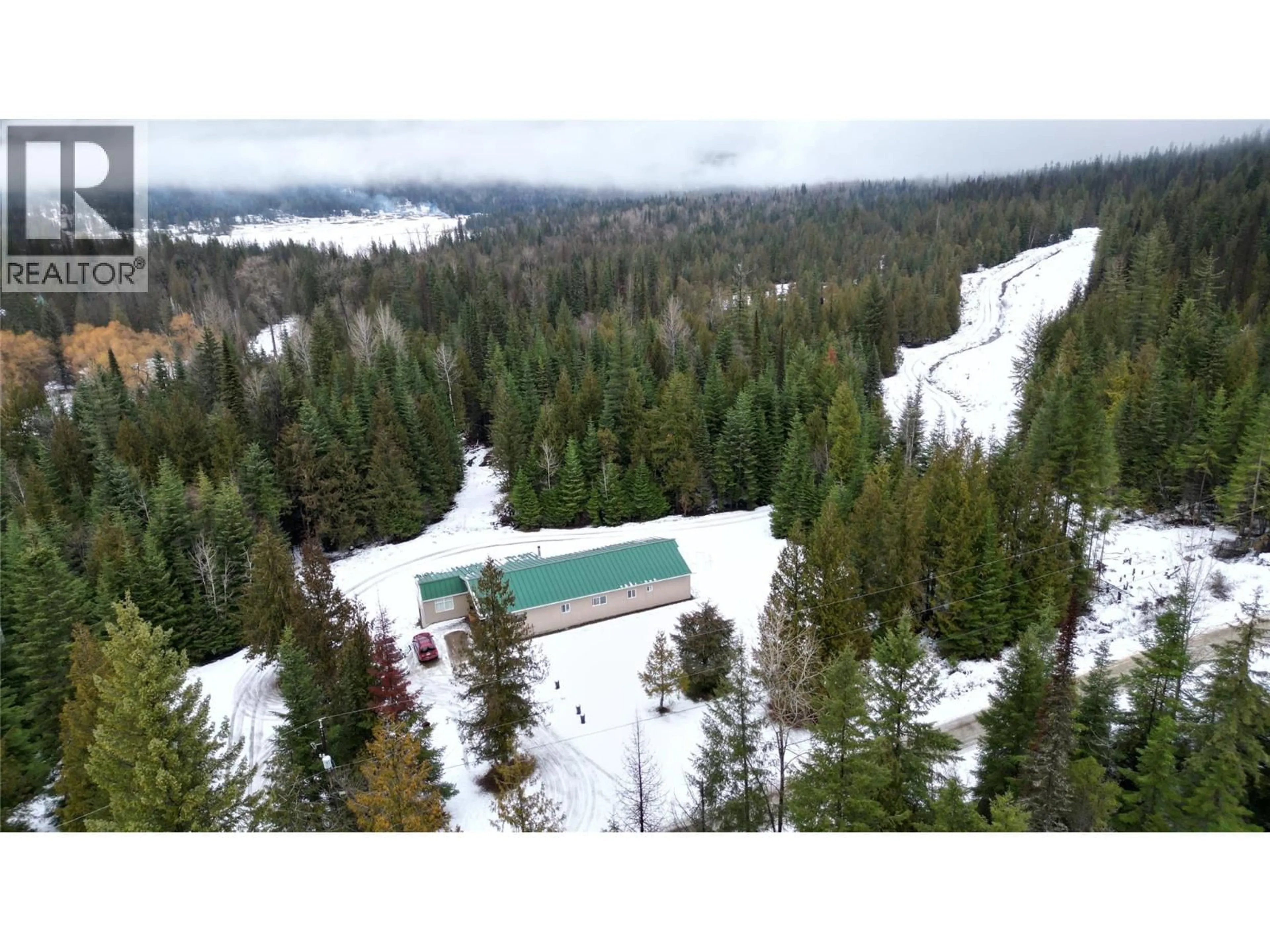 A pic from outside/outdoor area/front of a property/back of a property/a pic from drone, forest/trees view for 1925 MCDANIELS ROAD, Castlegar British Columbia V1N4T2