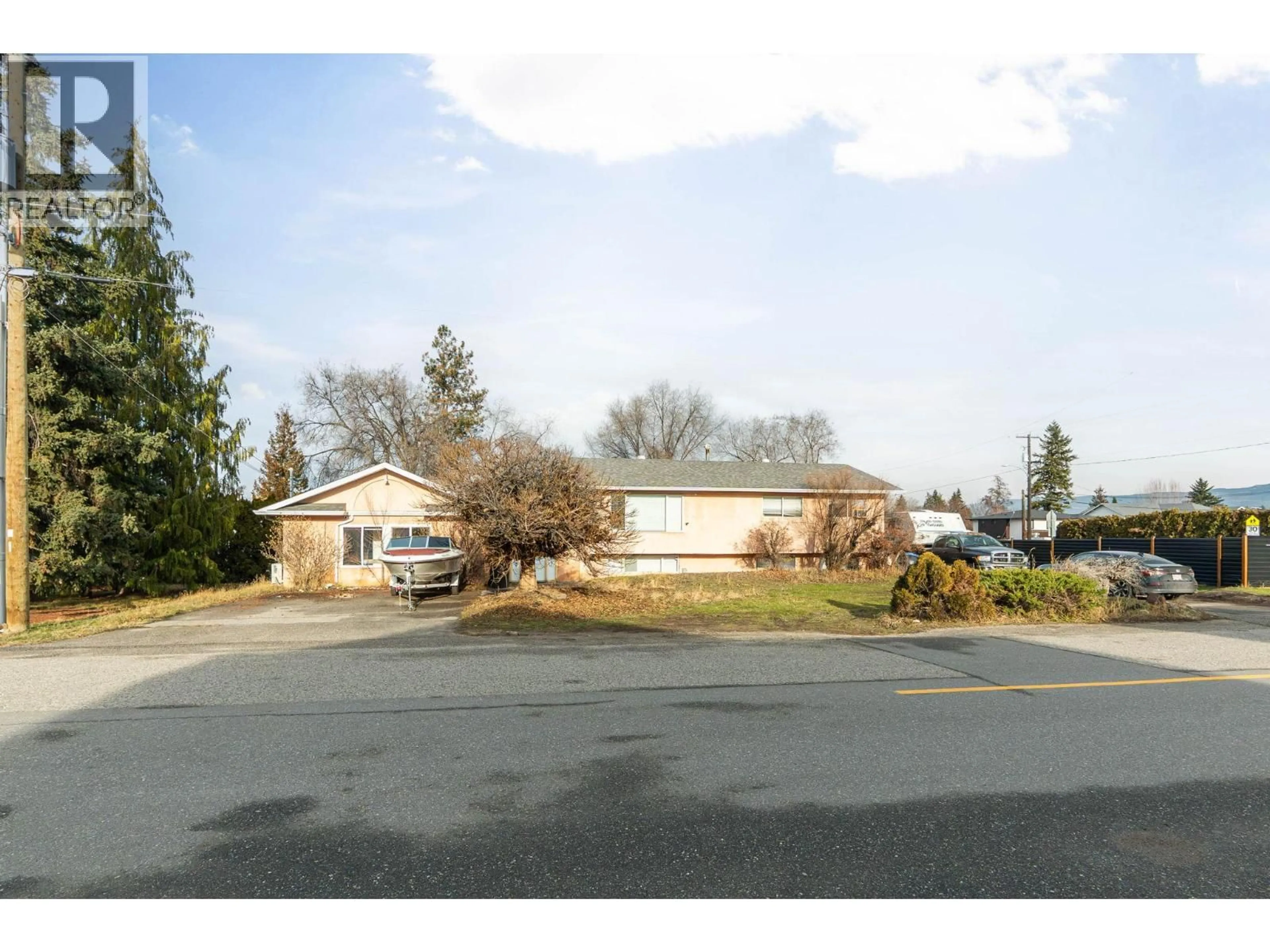 A pic from outside/outdoor area/front of a property/back of a property/a pic from drone, unknown for 698 BALSAM ROAD, Kelowna British Columbia V1W1B9